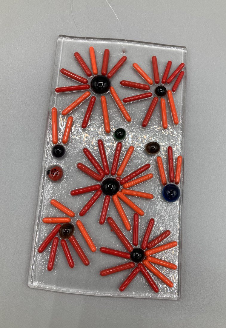 Red-Orange Starburst Flowers Hanger Fused Glass made by client.jpg