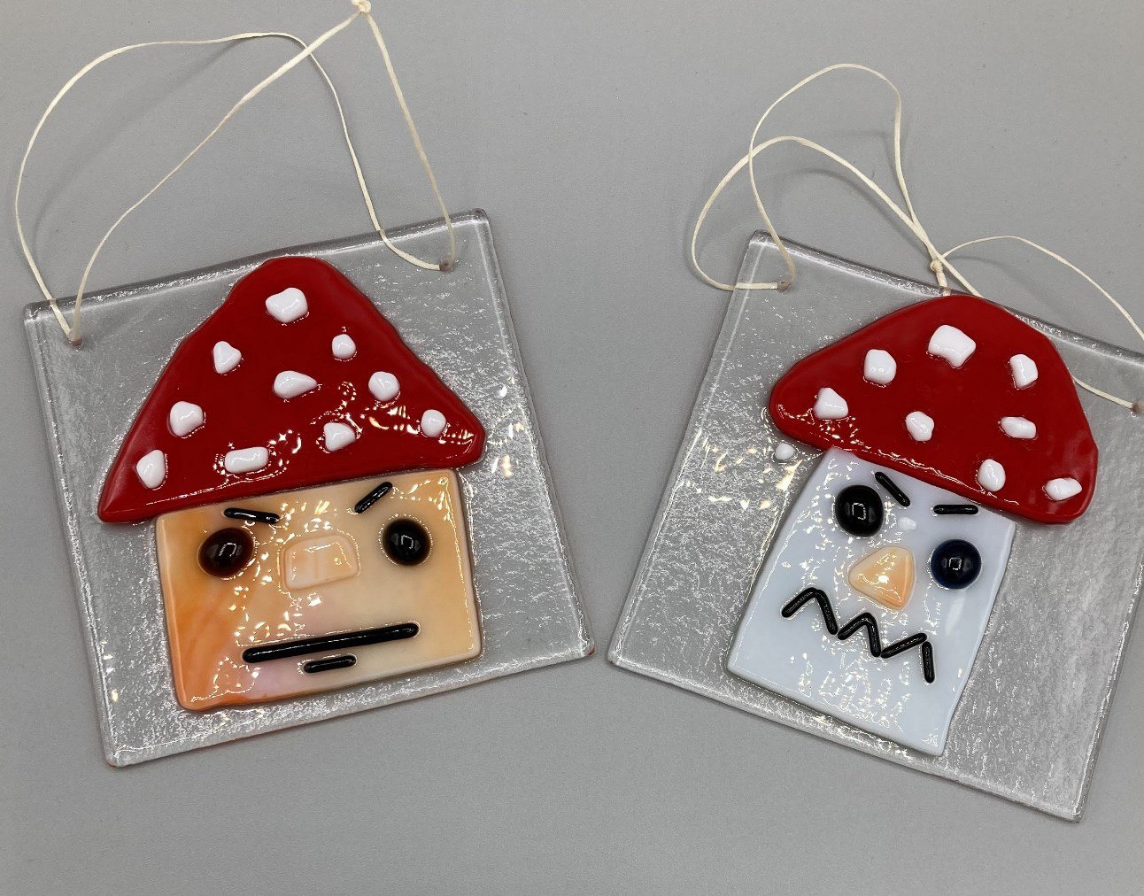 Two Grumpy Face Toadstool Hangers Fused Glass made by client.jpg