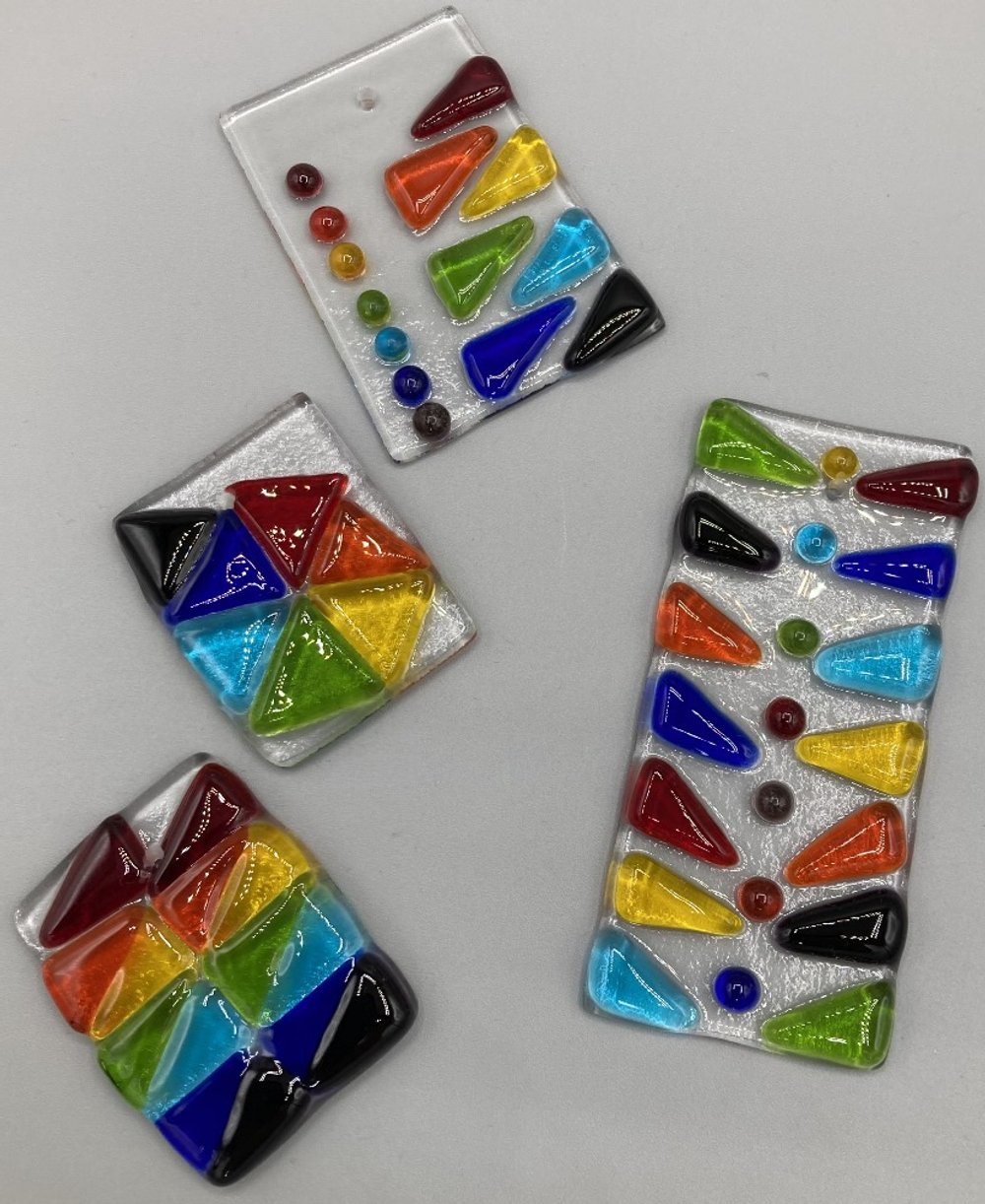 Four Assorted Abstract Rainbow Plaques Fused Glass.jpg