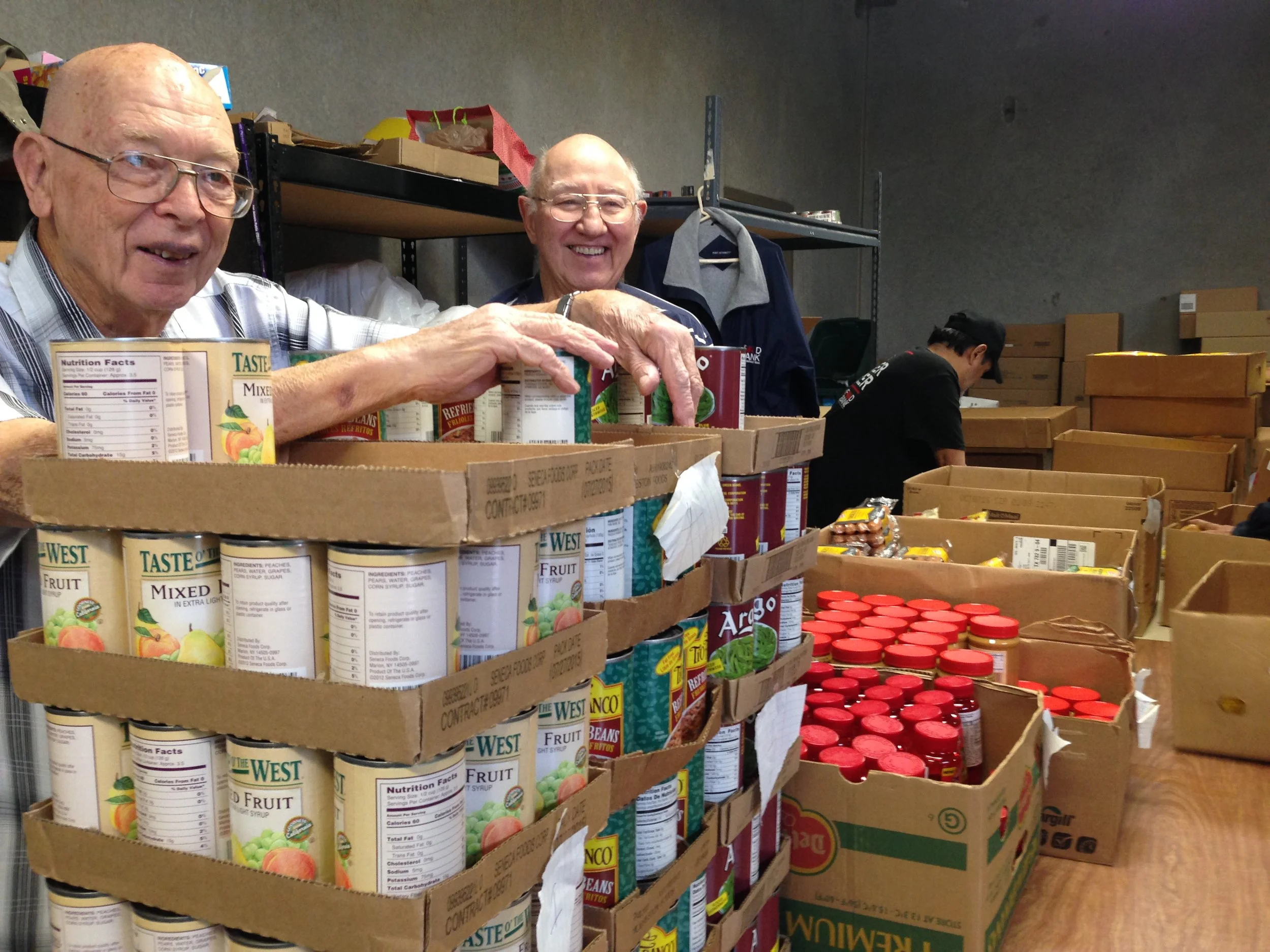 Saturday Distribution Days Larry and Charles help with the twice a month distribution to neighborhood families in need of ongoing food assistance.
