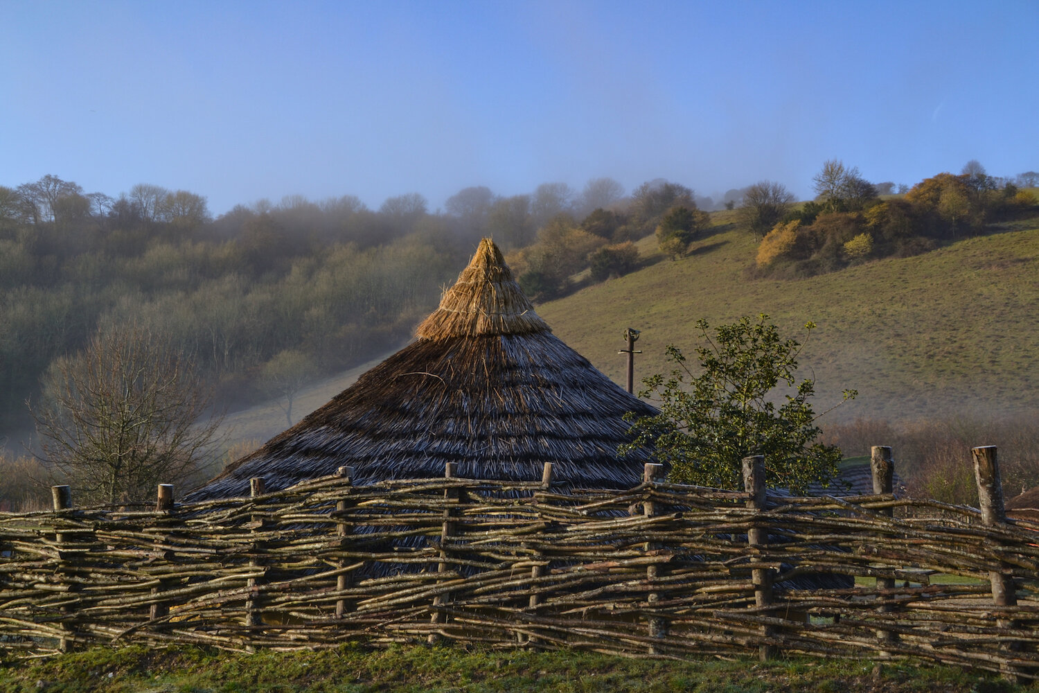 Butser Ancient Farm Iron Age Roundhouse with wattle fence