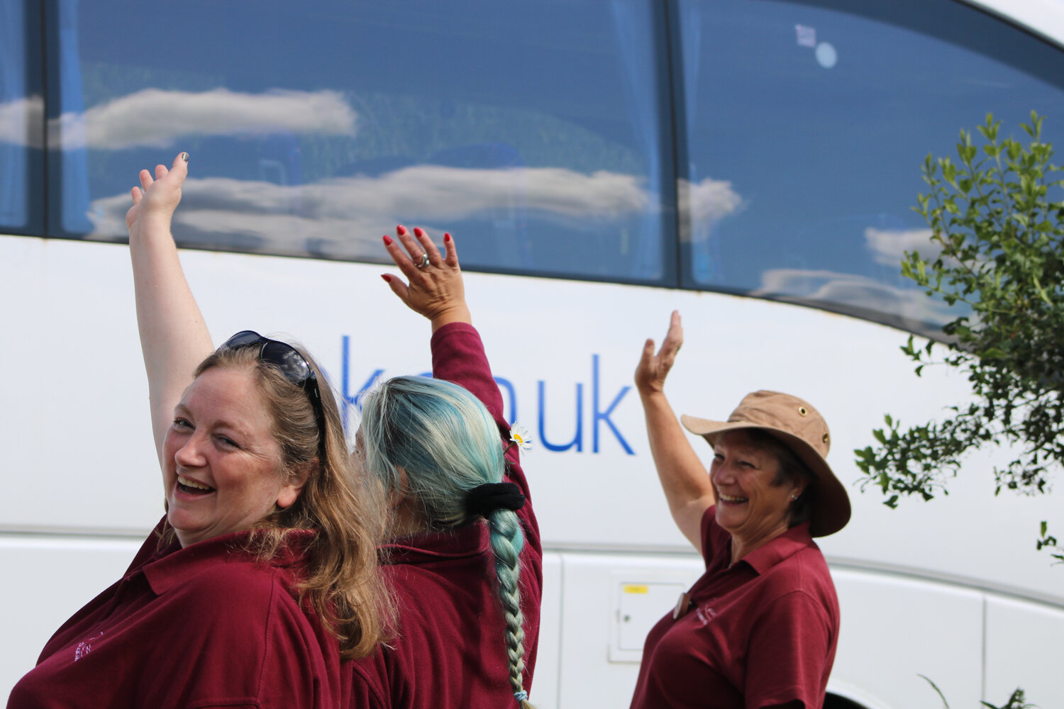 Butser staff waving to school trip coach