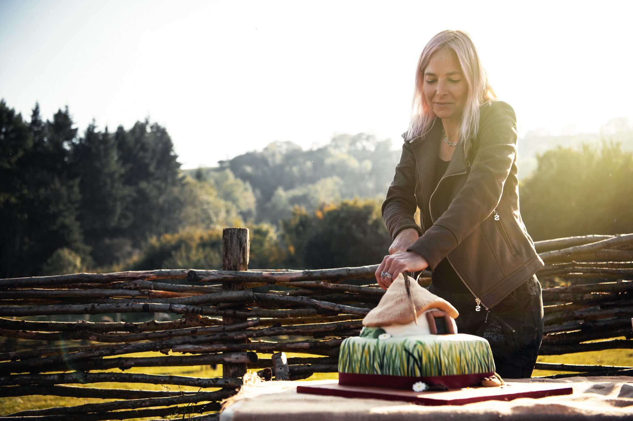 Professor Alice Roberts cuts the cake