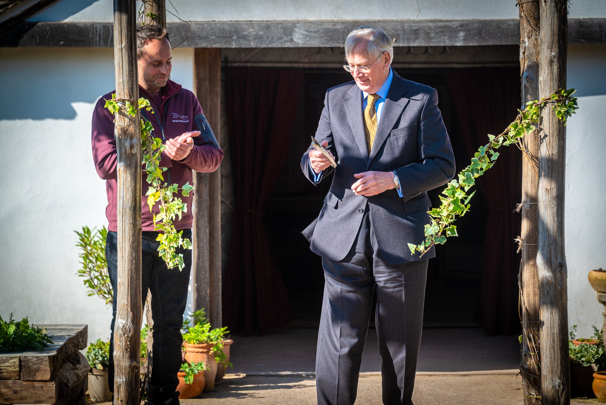 The Duke of Gloucester cuts the ivy garland