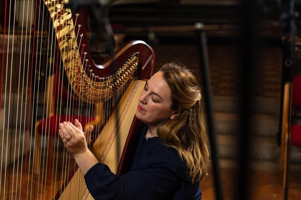 Woman playing harp