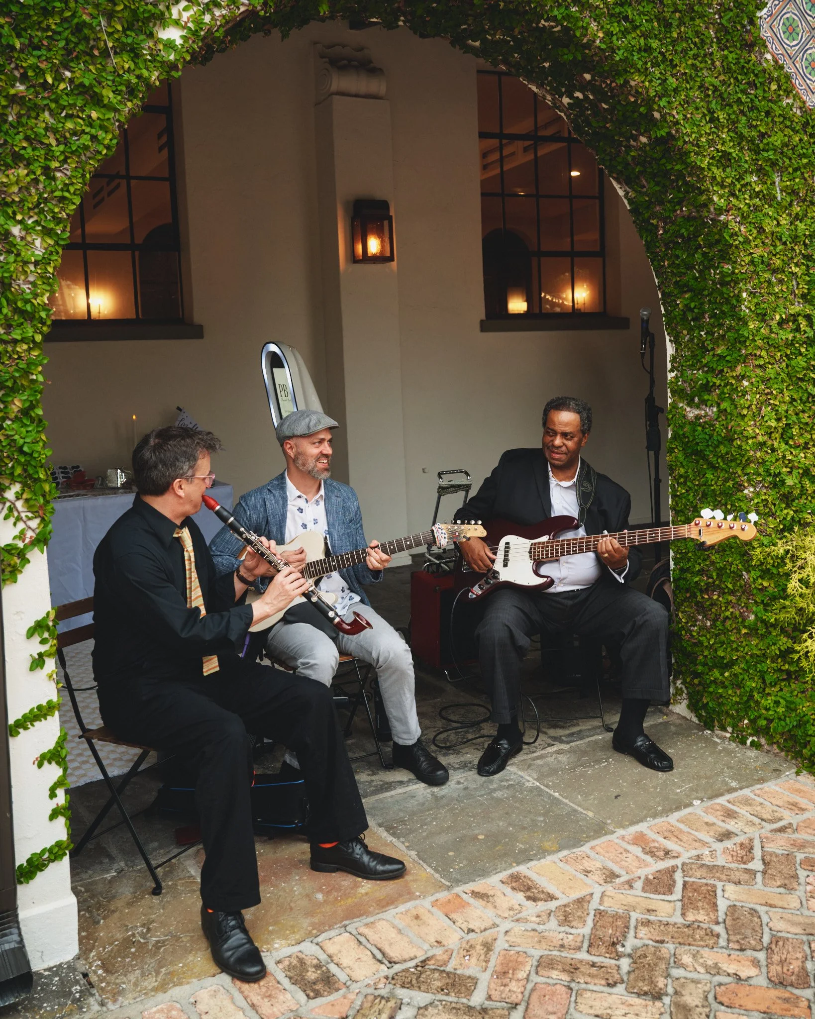  A jazz trio playing under the ivy archway during cocktail hour at Il Mercato in New Orleans 