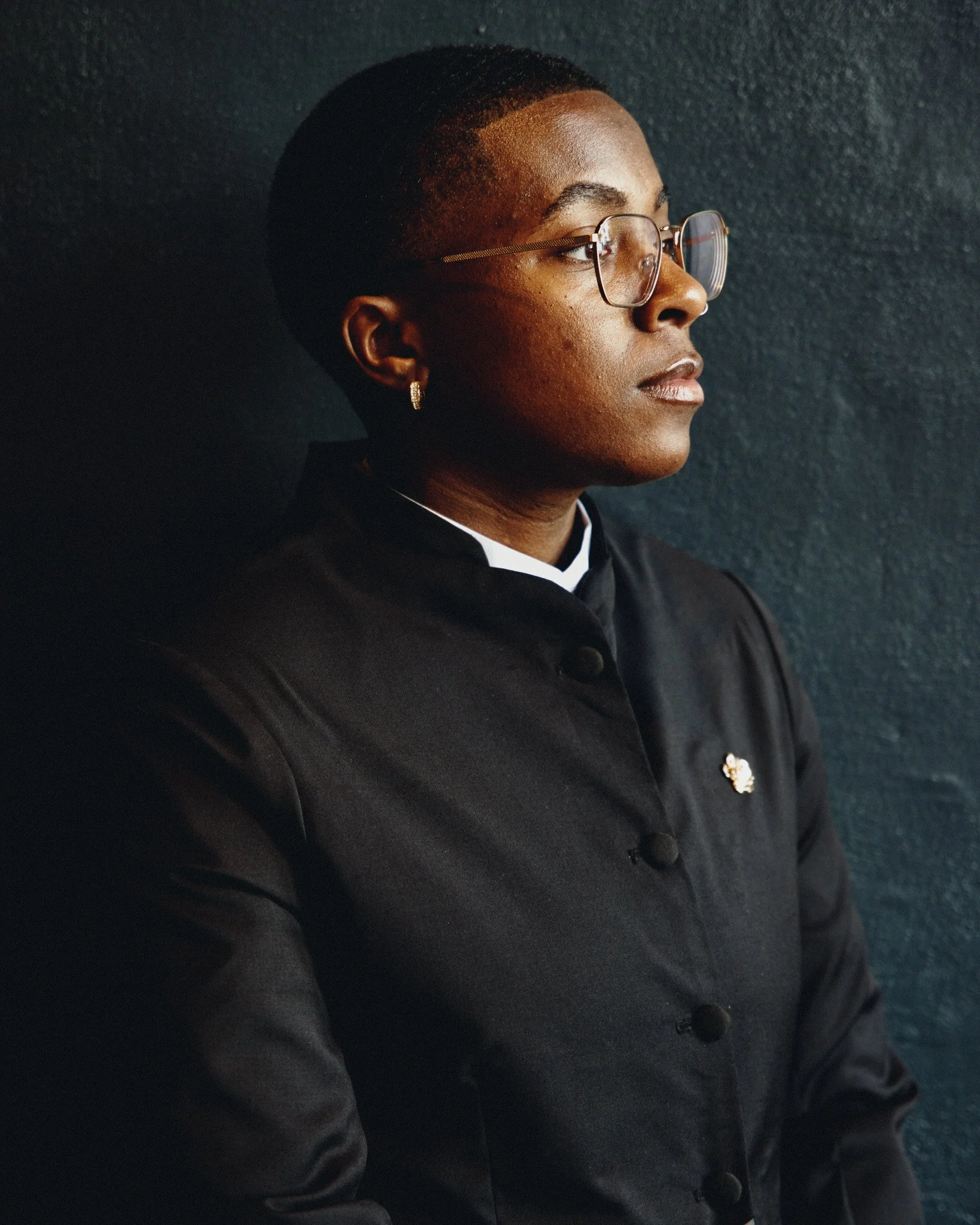  A portrait taken against a dark wall before the ceremony 