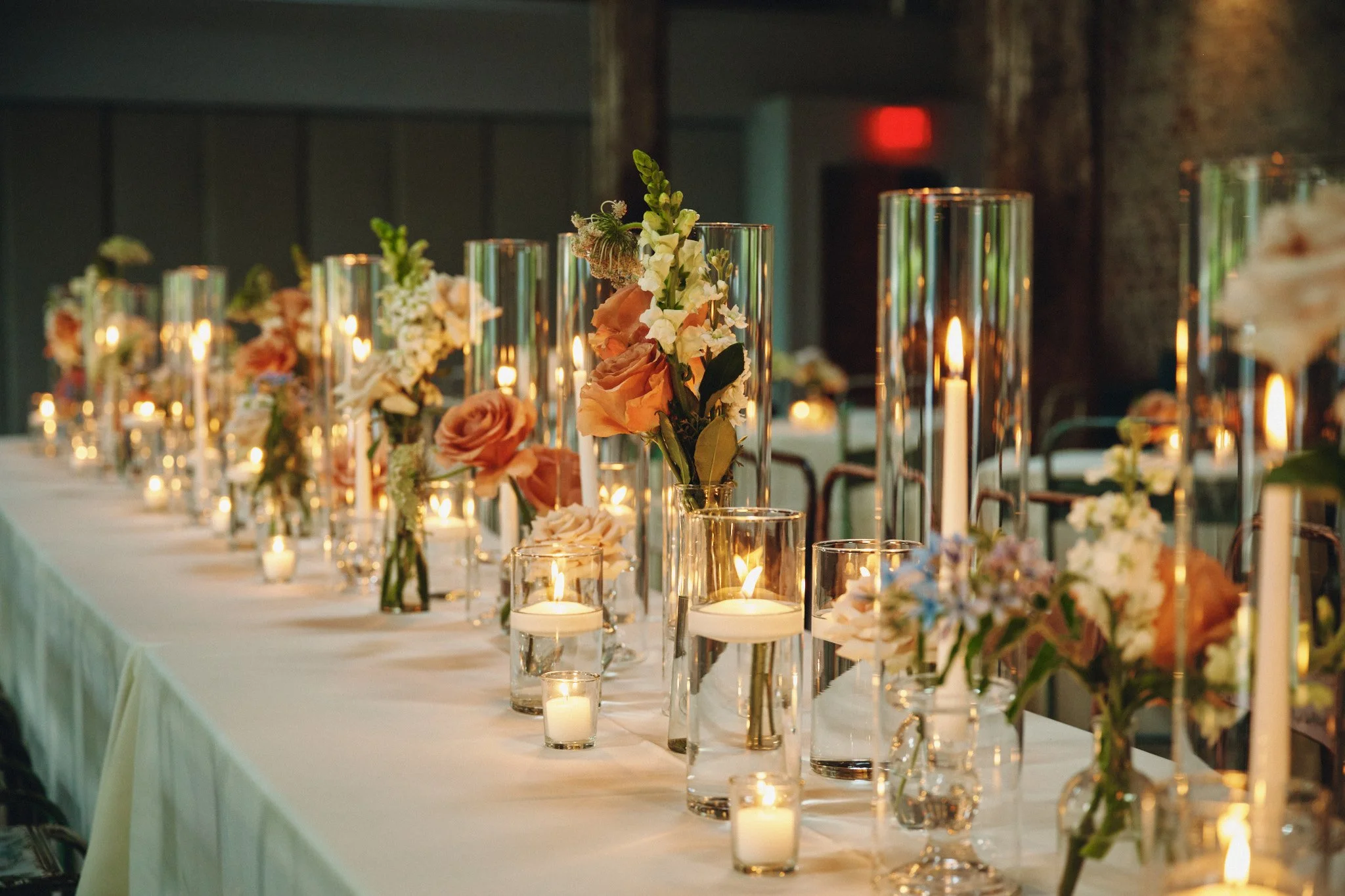  A candlelit tablescape set for a wedding dinner at Capulet in New Orleans 