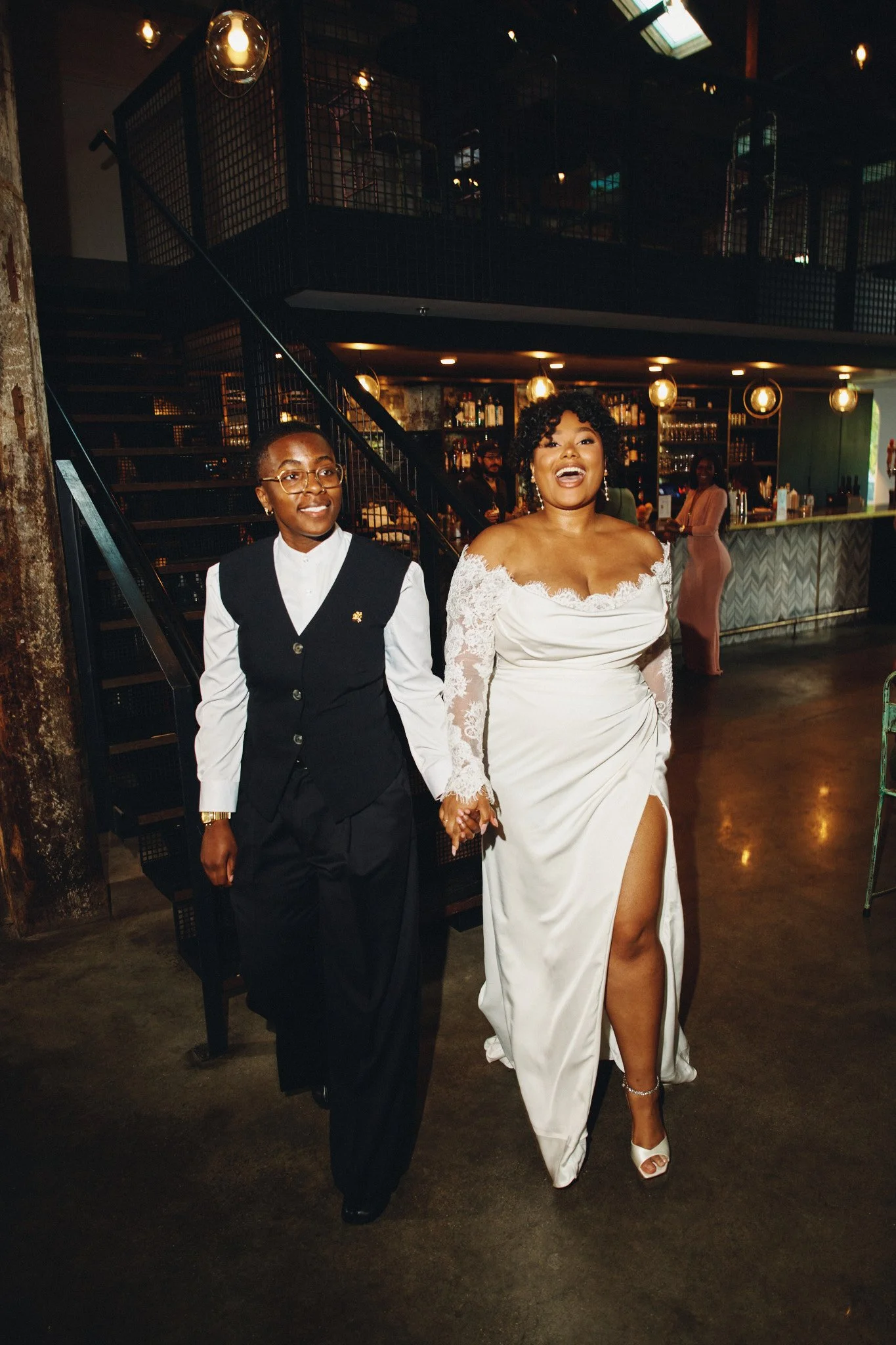  A couple walking into their reception at Capulet in New Orleans 
