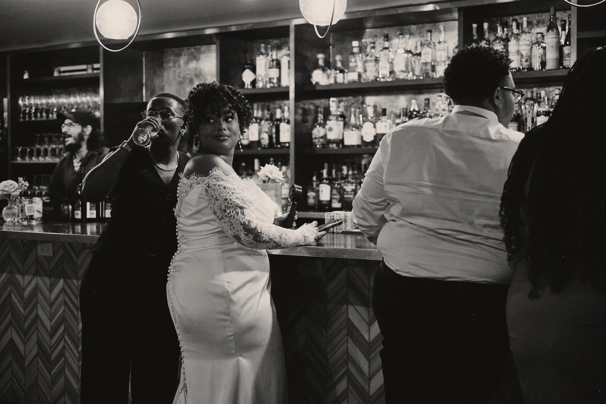 A bride at the bar during her wedding reception 
