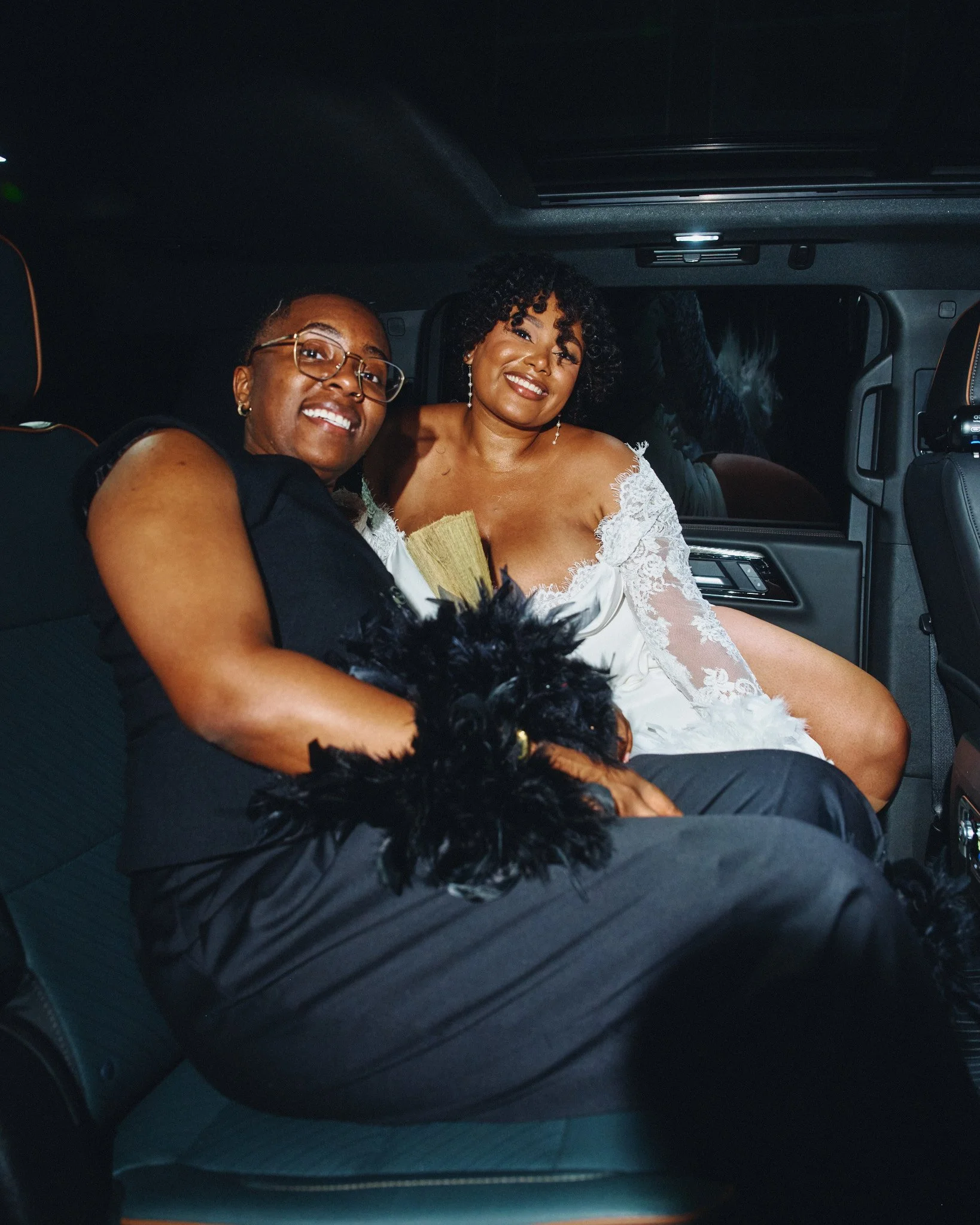  A couple in the car together at the end of their wedding night 