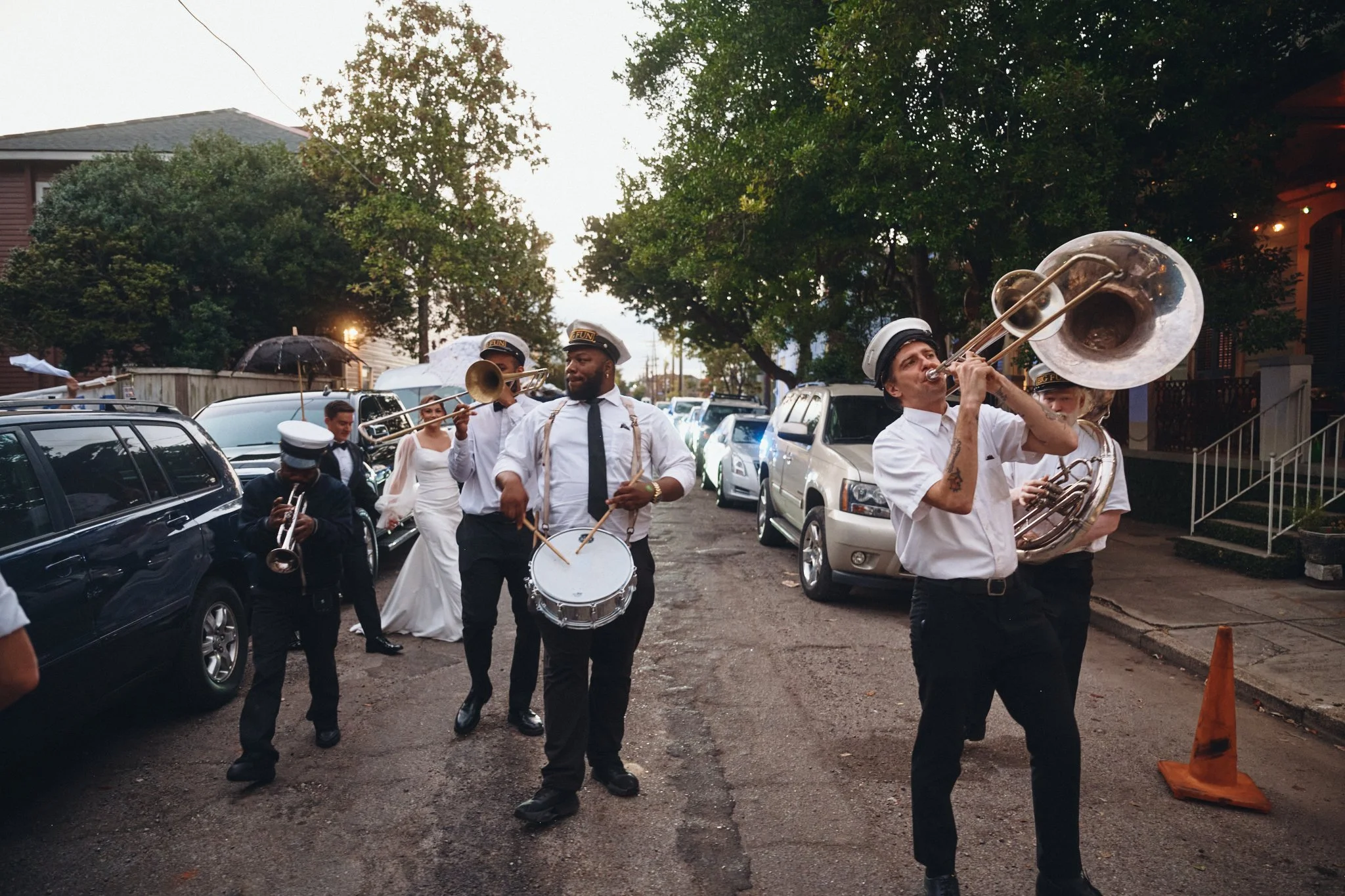  A New Orleans brass band leading a wedding second line down the street outside Capulet in New Orleans 