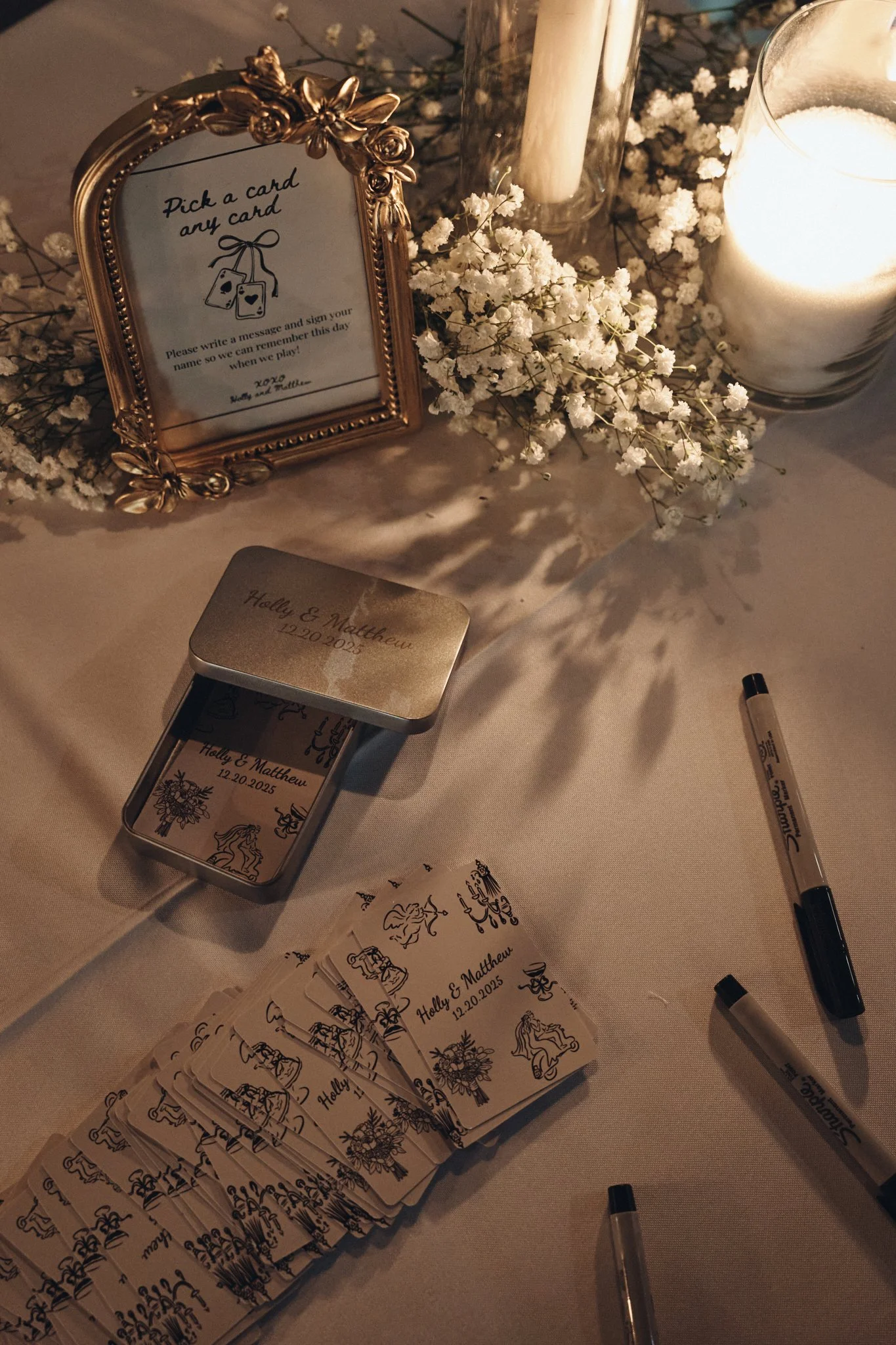  A guest book alternative of illustrated cards and markers on a candlelit table at Capulet in New Orleans 