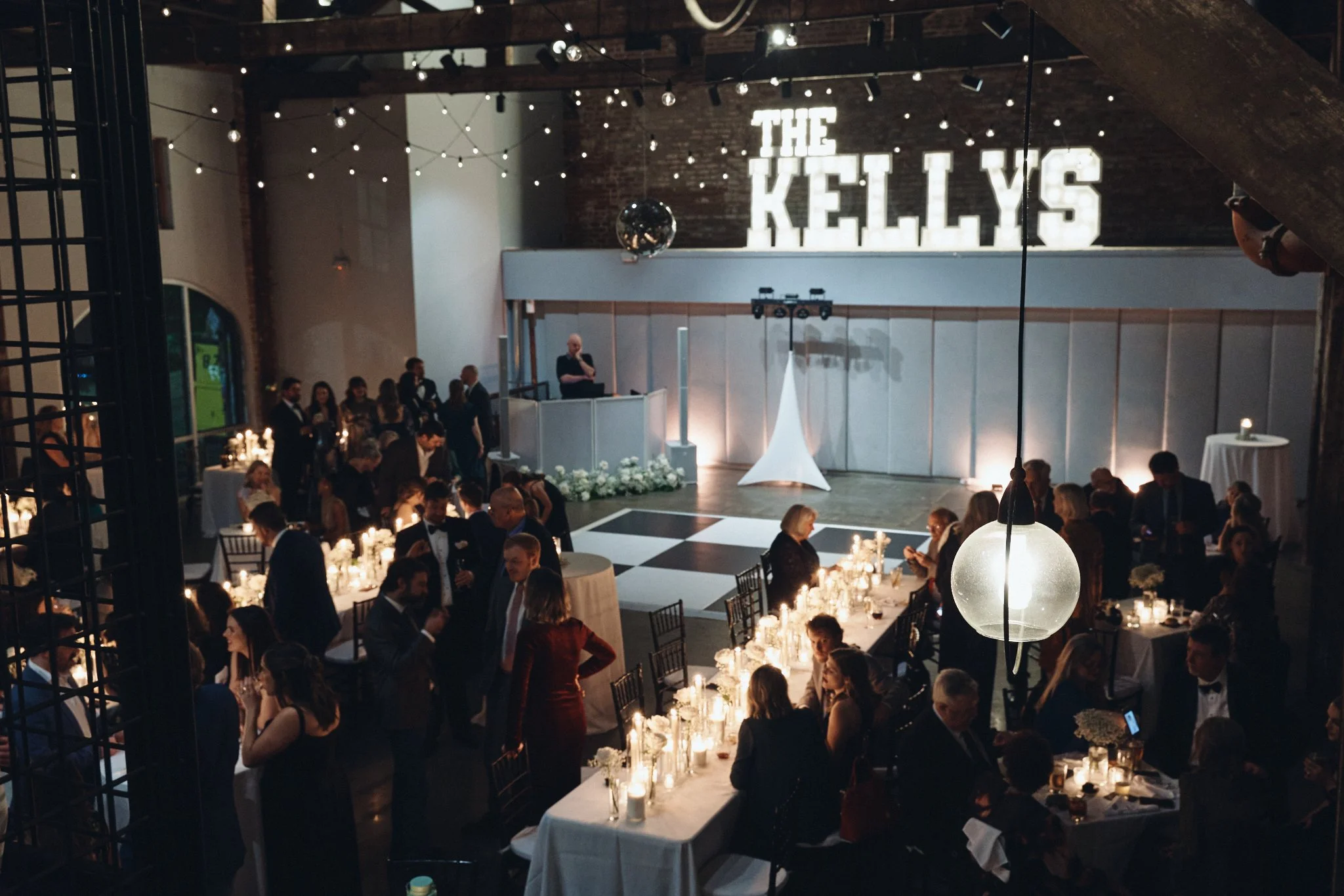  The reception seen from the mezzanine, marquee letters lit above the dance floor at Capulet in New Orleans 