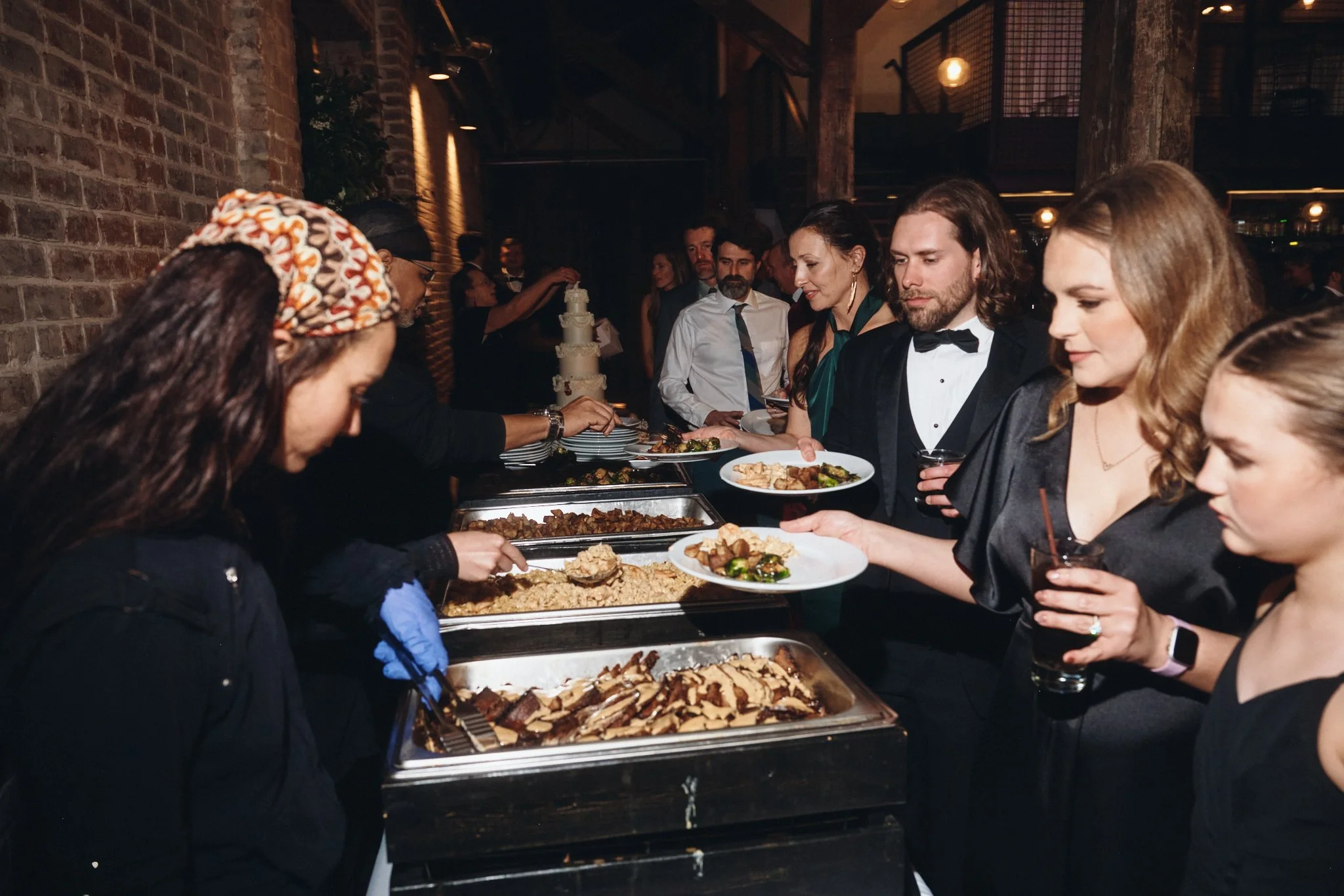  Guests being served from the buffet at a wedding reception at Capulet in New Orleans 