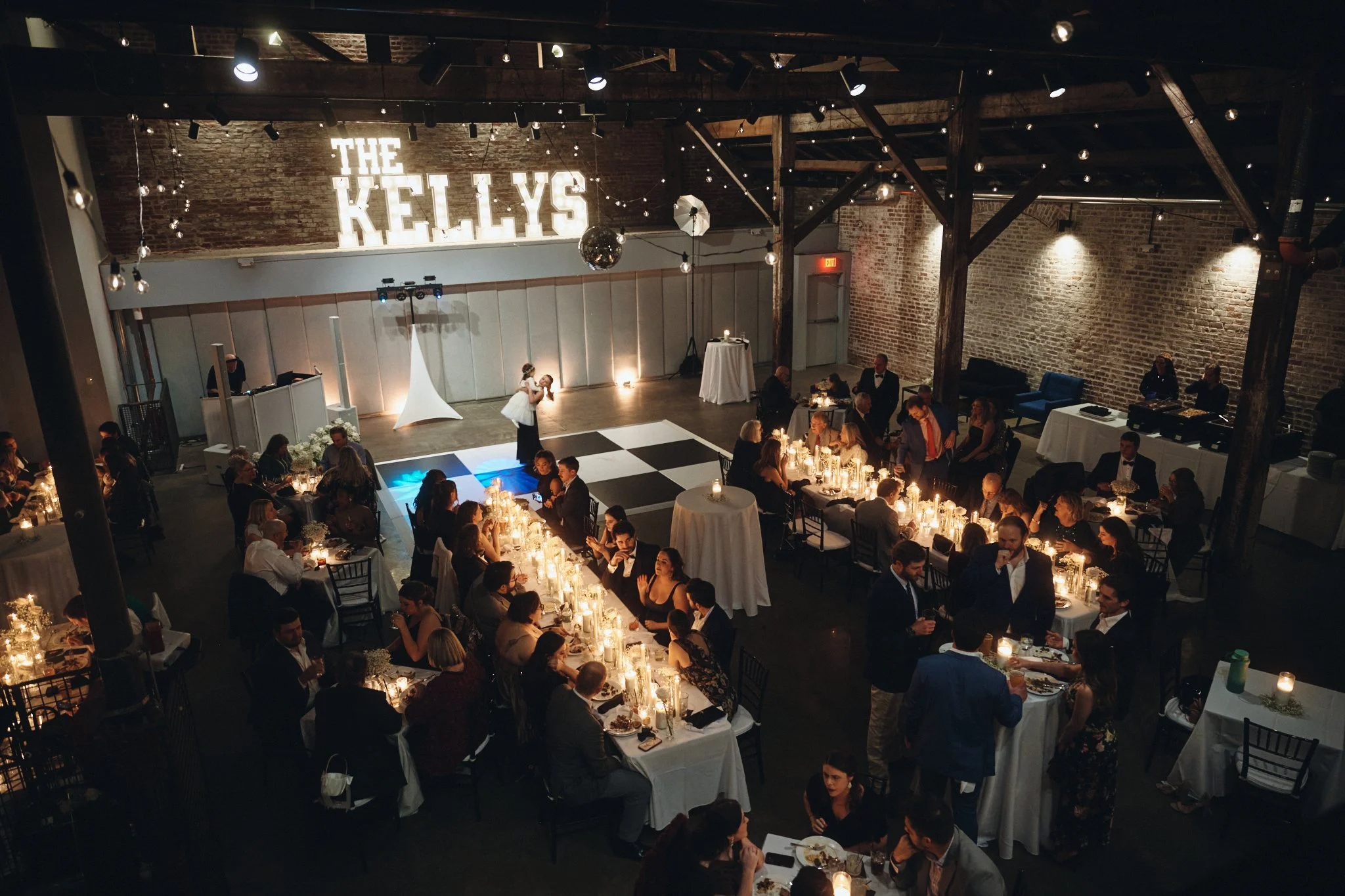  The full reception from above, dinner tables and dancing under the trusses at Capulet in New Orleans 