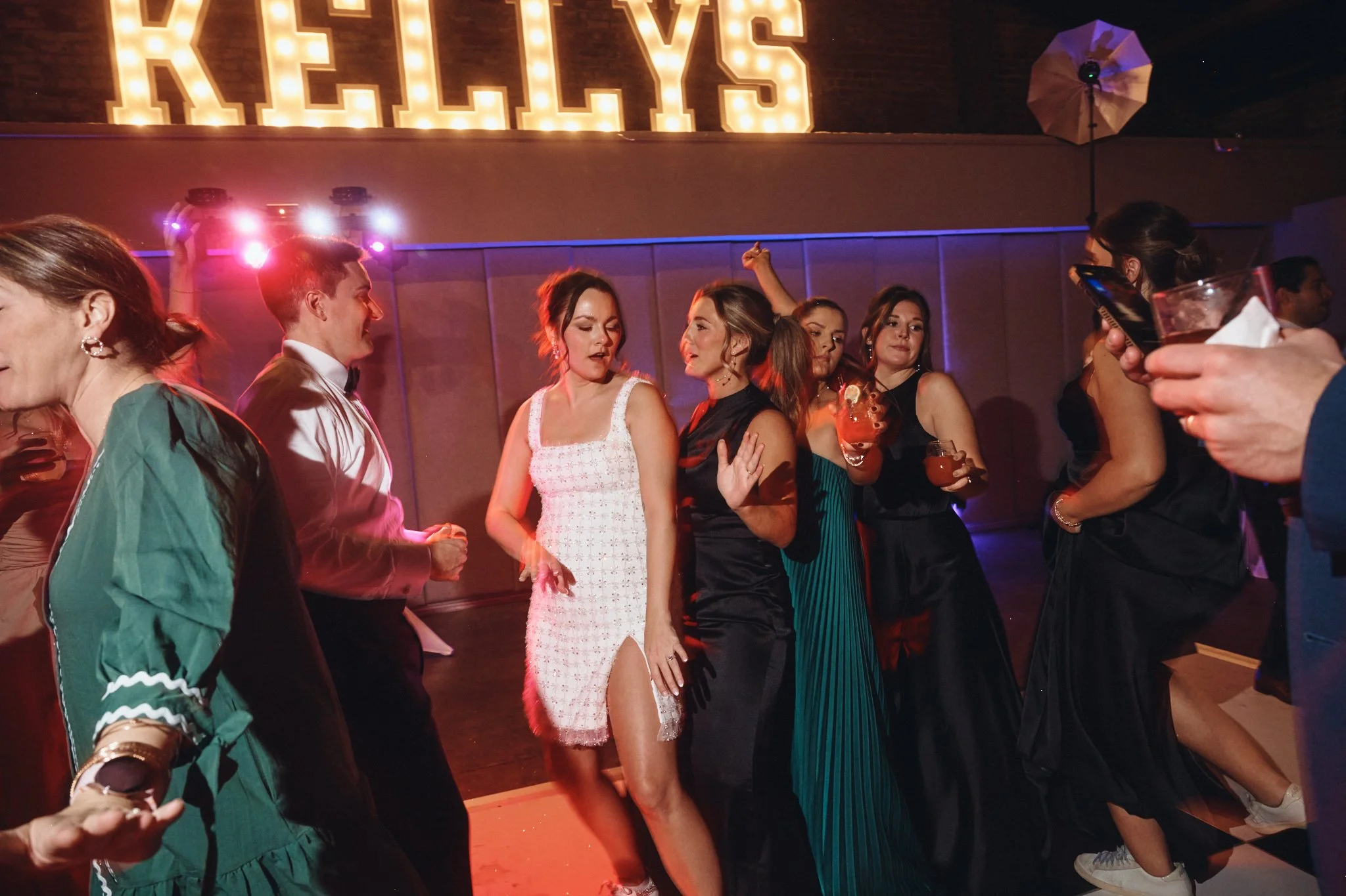  Guests dancing under the lit marquee letters late in the reception at Capulet in New Orleans 