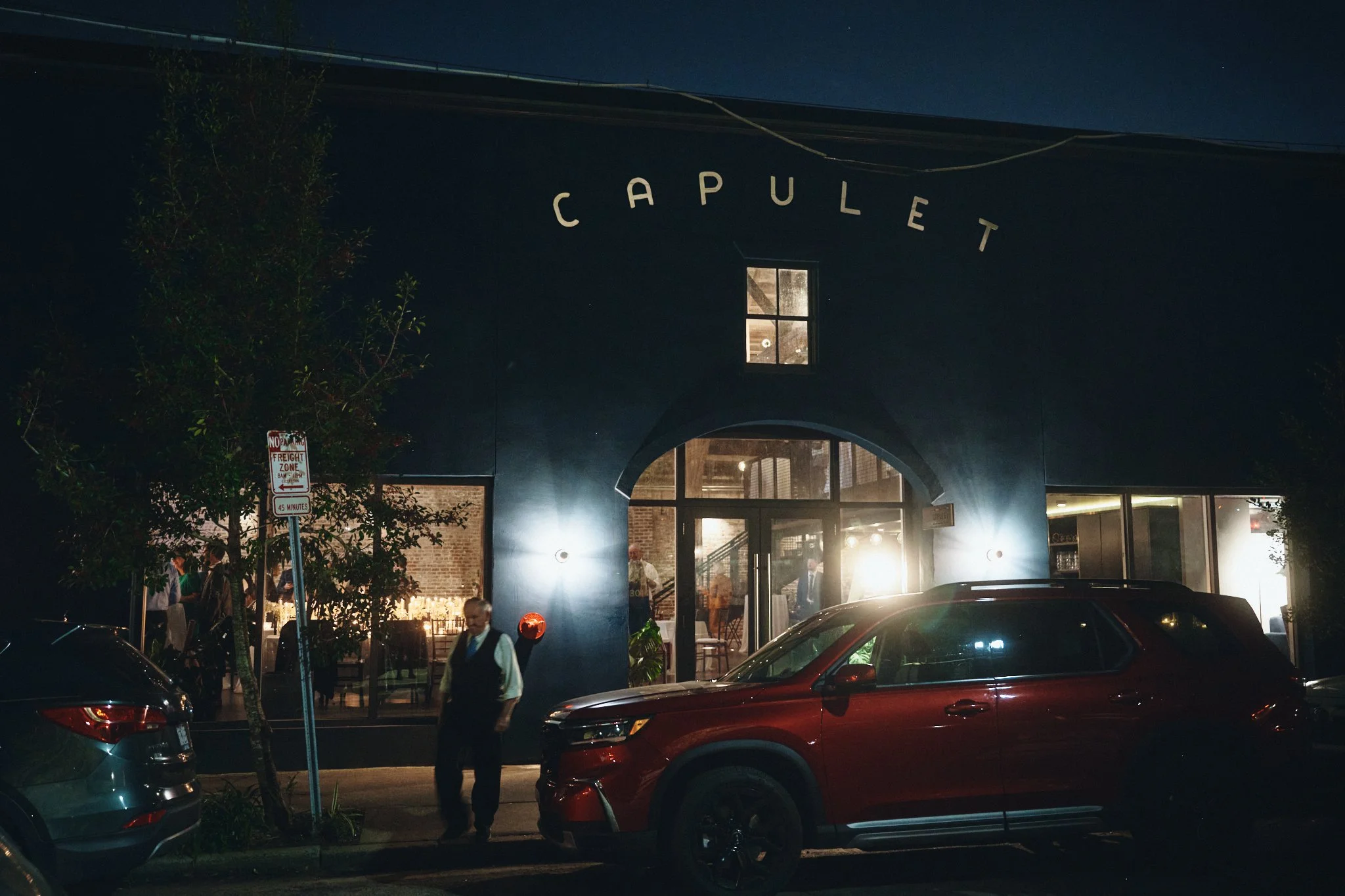  The Capulet building lit at night on the street in the Bywater, New Orleans 
