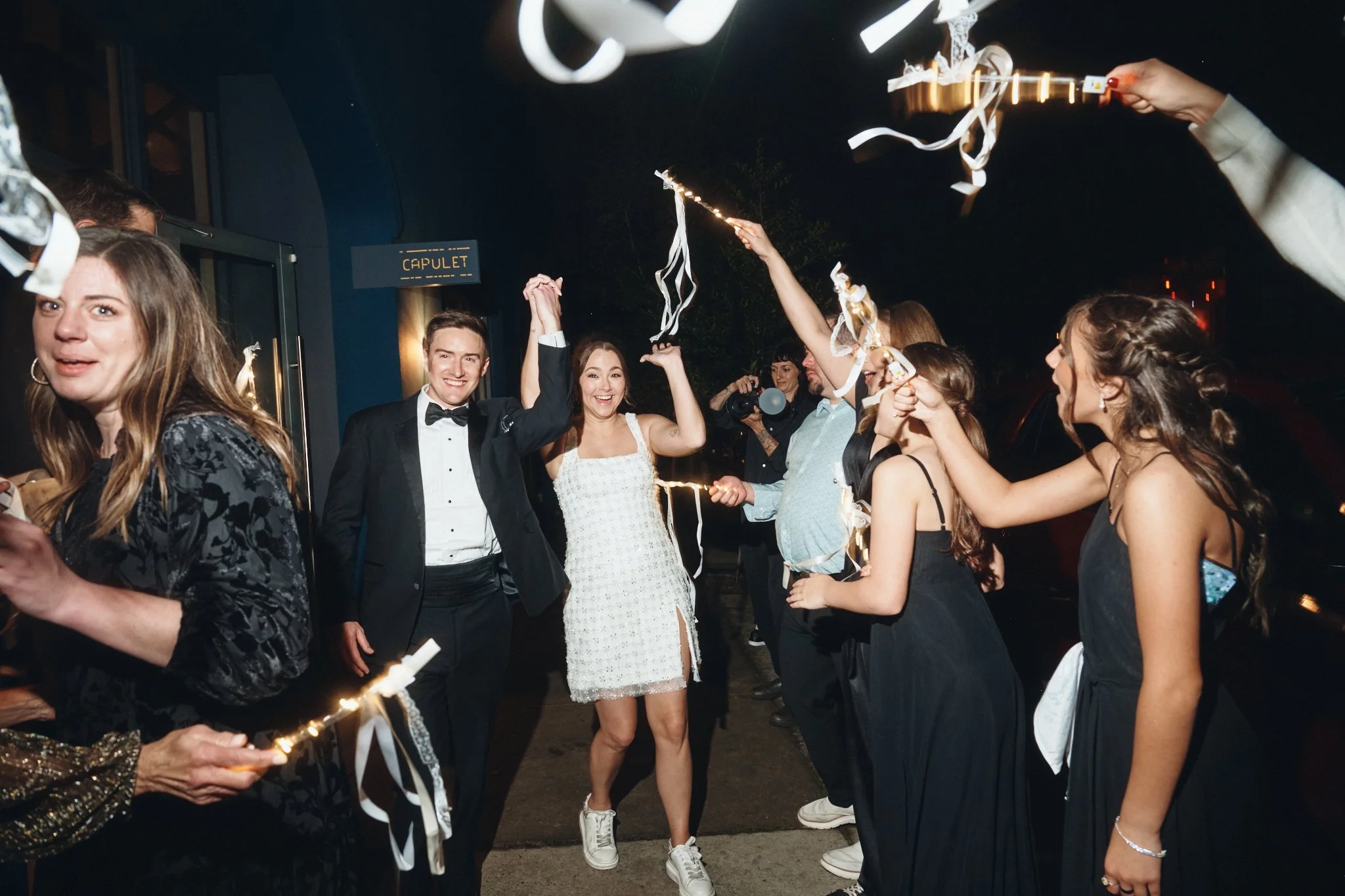  A bride and groom leaving through a sparkler send-off from the venue outside Capulet in New Orleans 
