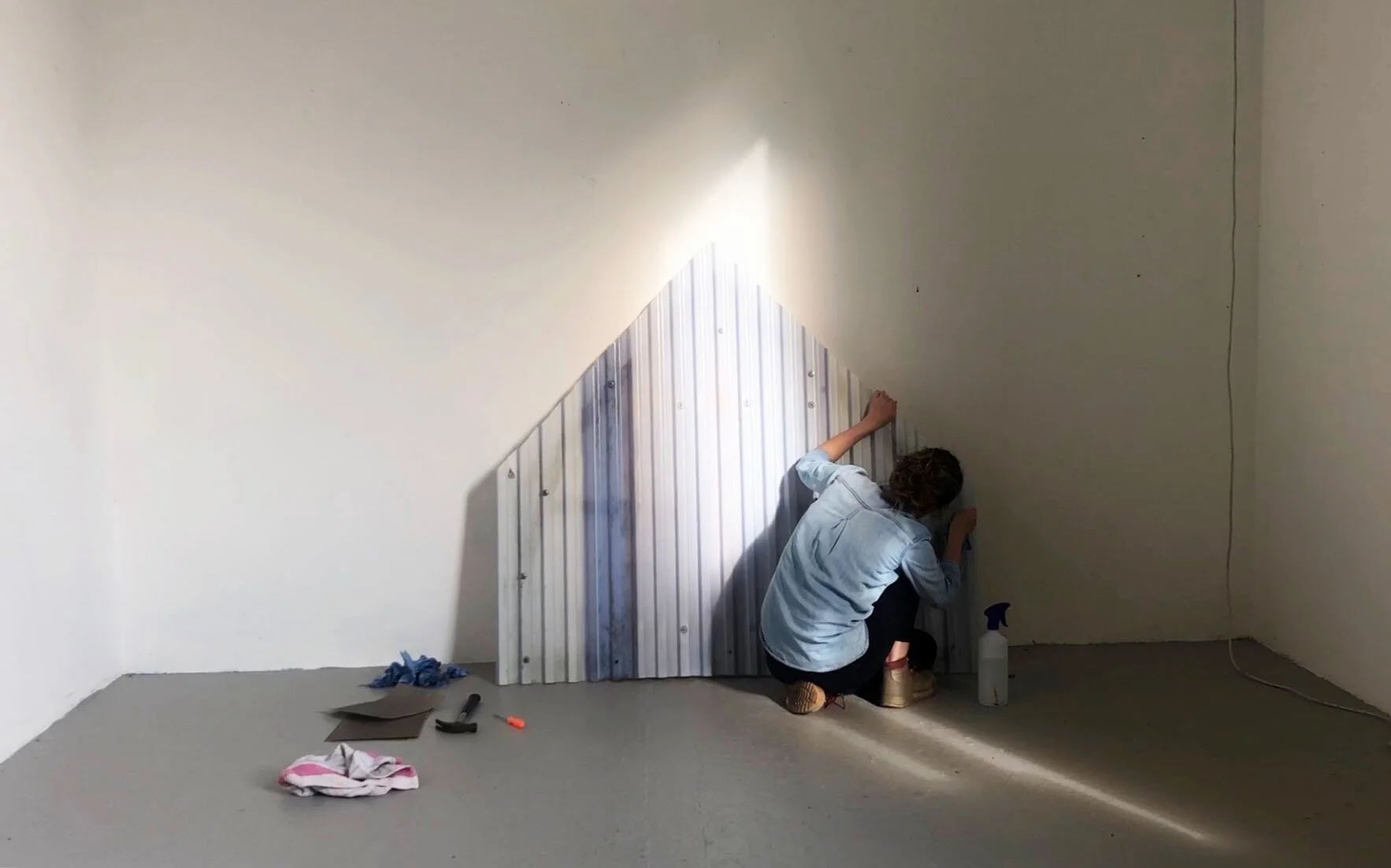  Exploring the concept of caring for a dwelling, through the active process of physical maintenance and cleaning.  I collected the found object of the house frame,  took it apart, and then restored it through cleaning, sanding, and repainting. 