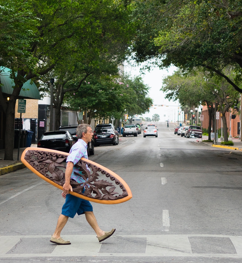 John headed to the gallery with a board named Abby.