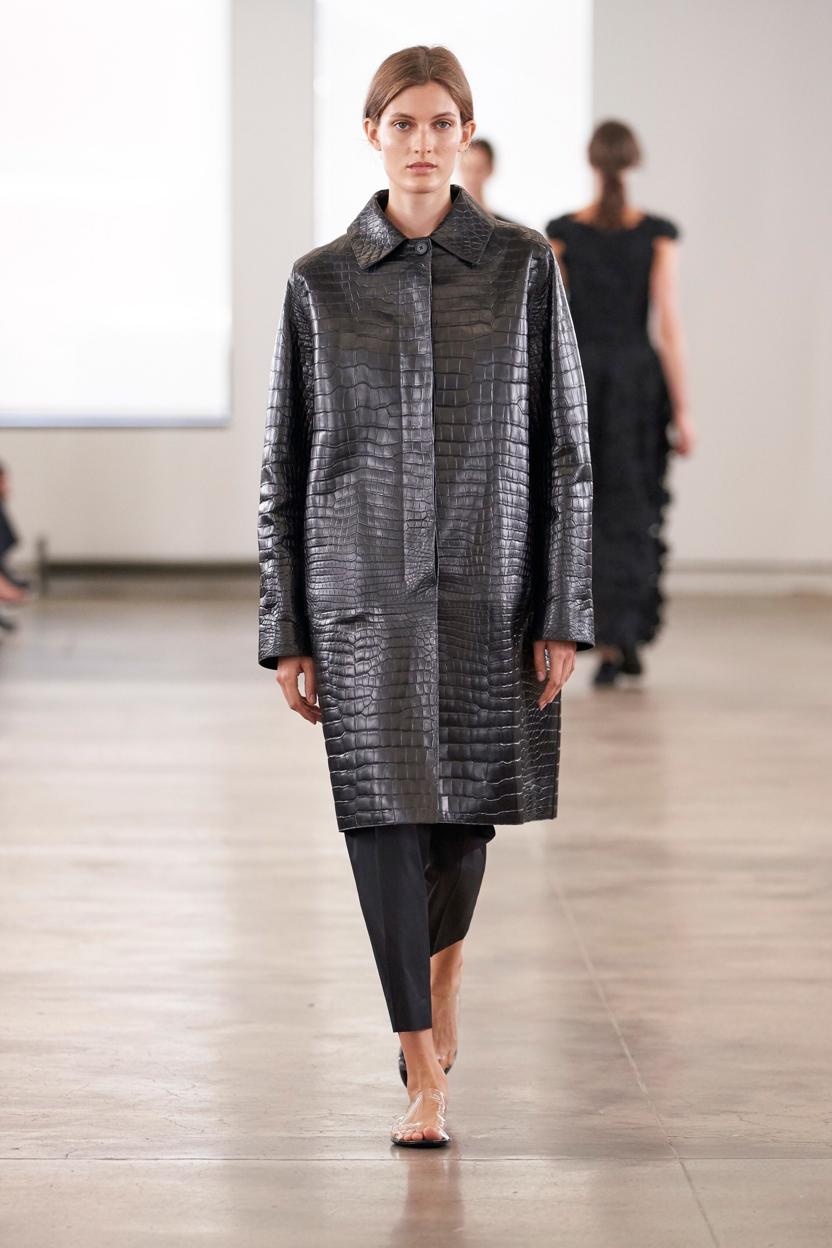 Austere, monastic, minimal leather coat at The Row S/S 2020 collection.