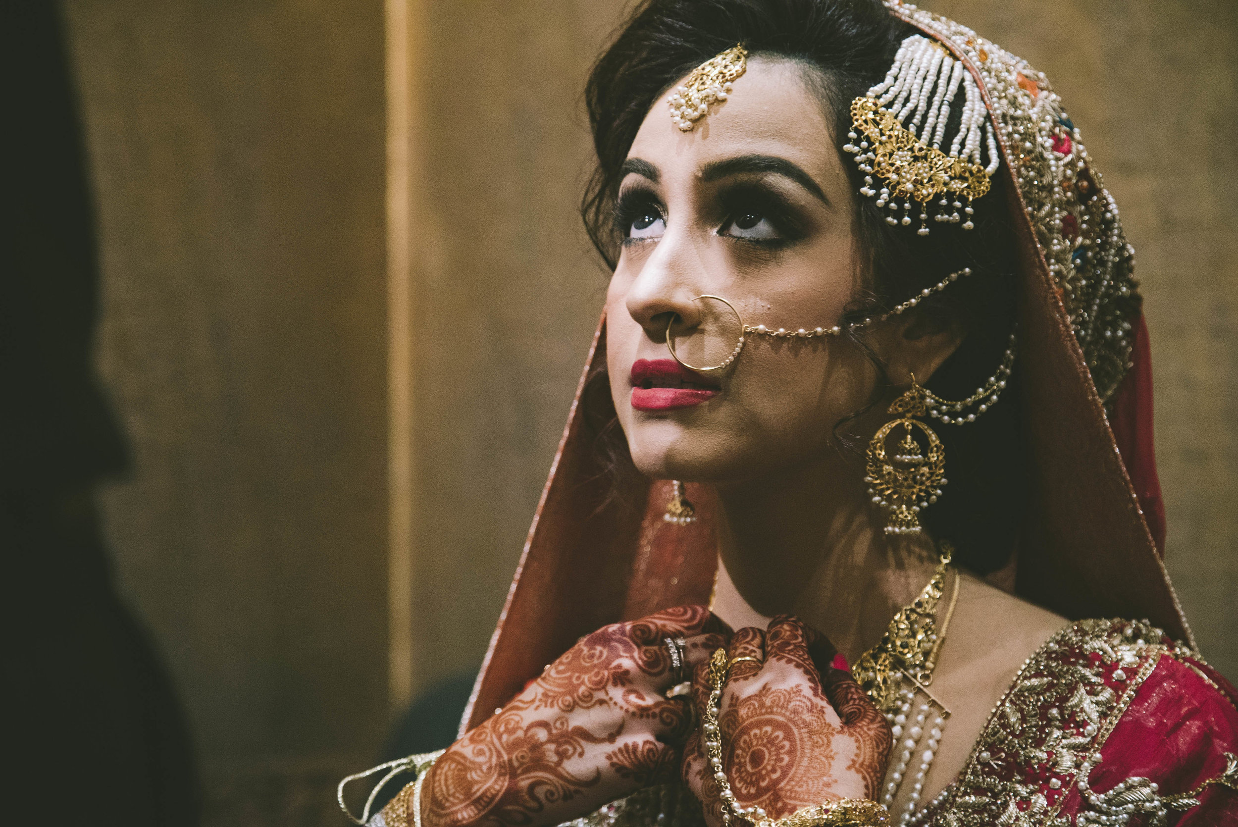  Sadaf Sadal, overcome with nerves, is comforted by friends and family on the day of her  baraat . The  baraat  is a particularly emotional day for brides, because it is the day that the bride goes to her new family's home. Having usually lived with 