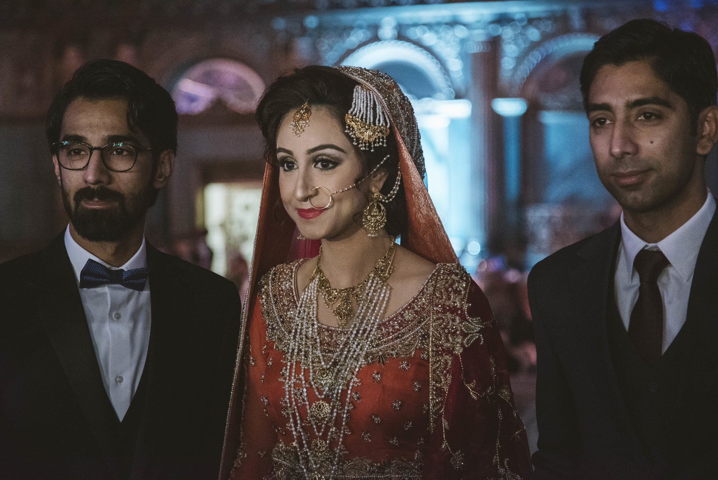  Sadaf Sadal is walked "down the aisle" to her new husband on the day of her  baraat , with her brothers Ayaz (left) and Zia (right) by her side. 