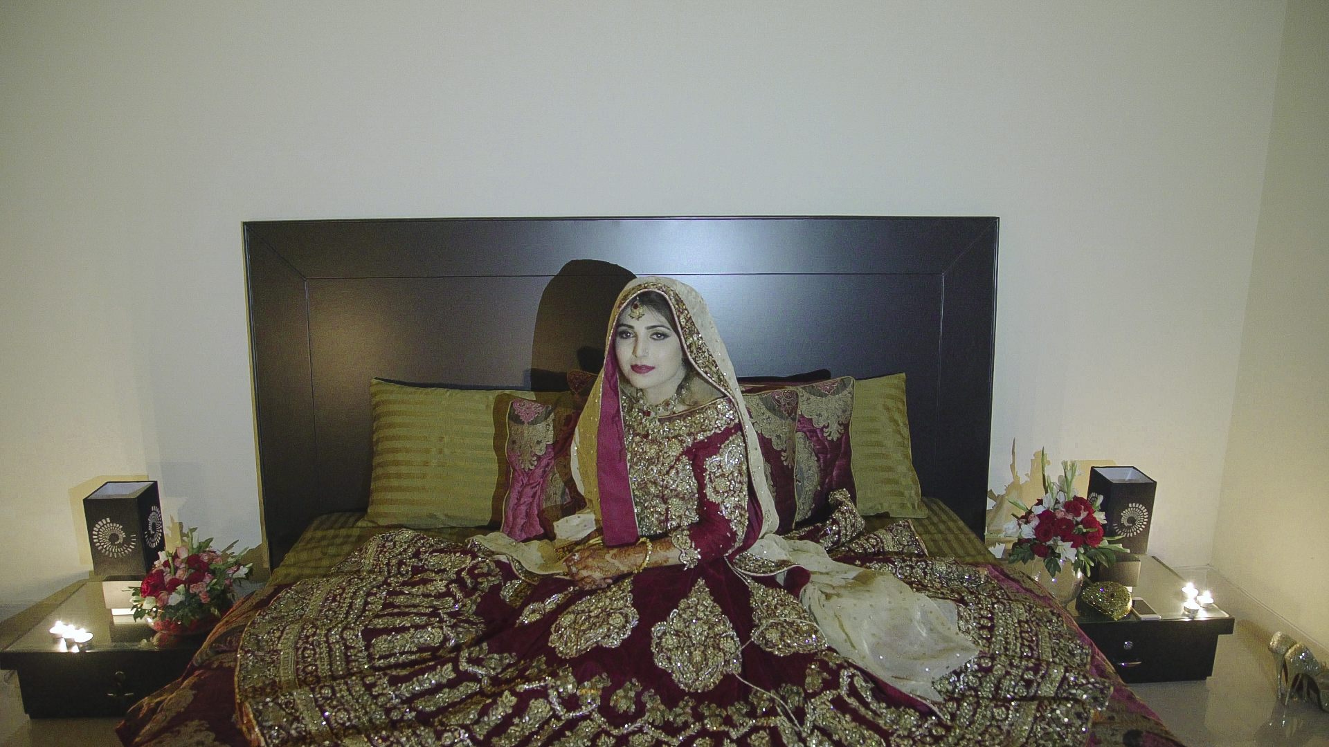  Ayesha Sadal waits for her husband in the candlelight of their bedroom on the night of their  baraat . This significant ritual is called  suhag raat , which refers to the first night and consummation of the marriage. Traditionally, the female member