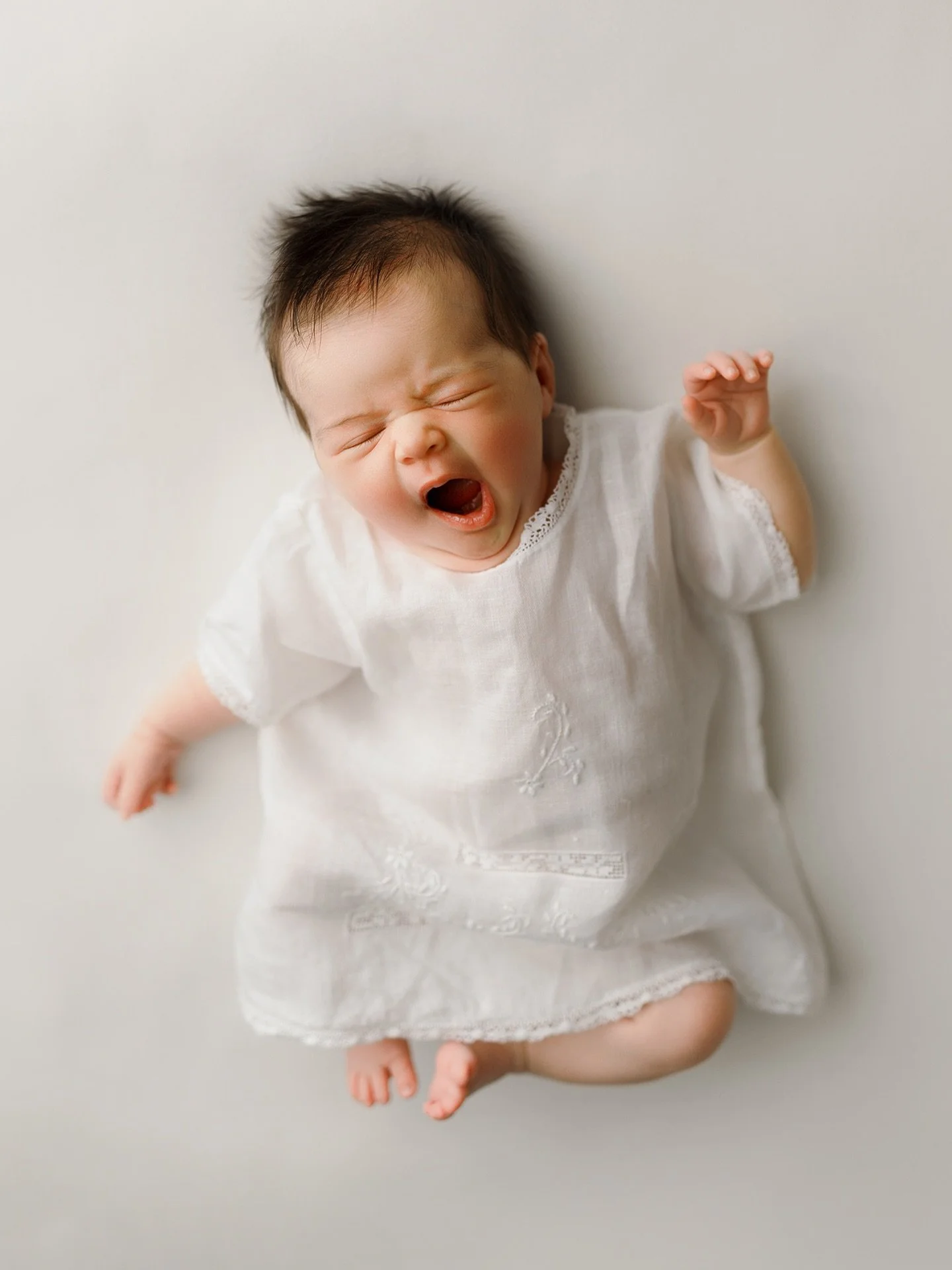 My style is pretty minimal, clean, and timeless&mdash;I like to keep the focus on your newborn and your family, without too much distraction. 

That said, I do love adding in a special heirloom or meaningful item. It&rsquo;s those little personal tou