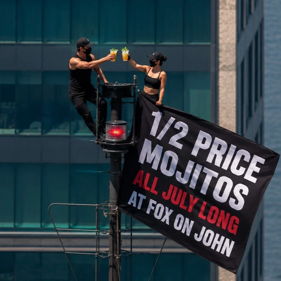 🚨 We can neither confirm nor deny who put this banner up... 👀

But we can confirm:
🍹 1/2 PRICE @ORIGINALBUMBU MOJITOS ALL JULY LONG at Fox on John.

Some people climb skyscrapers.
The rest of us just climb onto the patio. 😎

📍106 John St, Toront