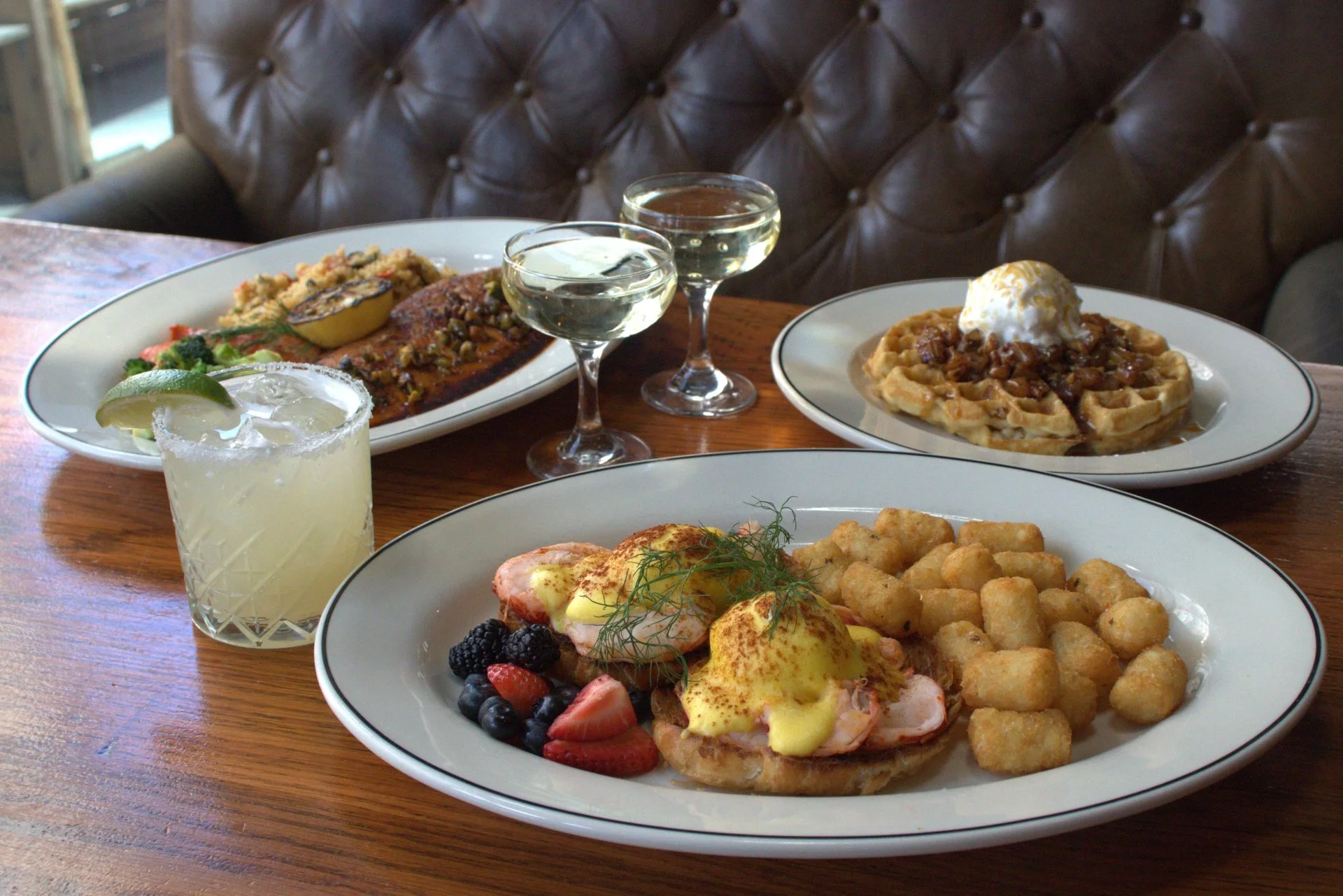 Mother’s Day brunch spread with eggs Benedict, waffles, cocktails, and savoury plates at Fox on John.