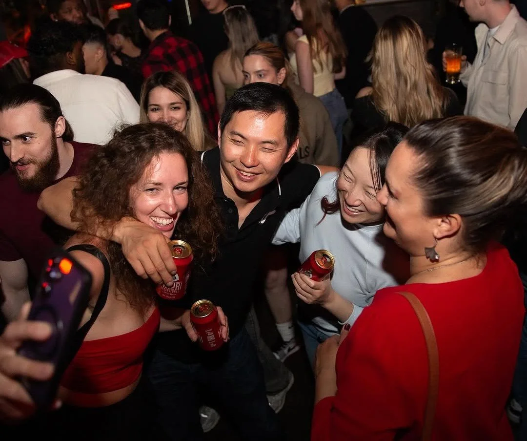 Group of friends  clicking selfies together and enjoying drinks at Fox on John, Toronto.
