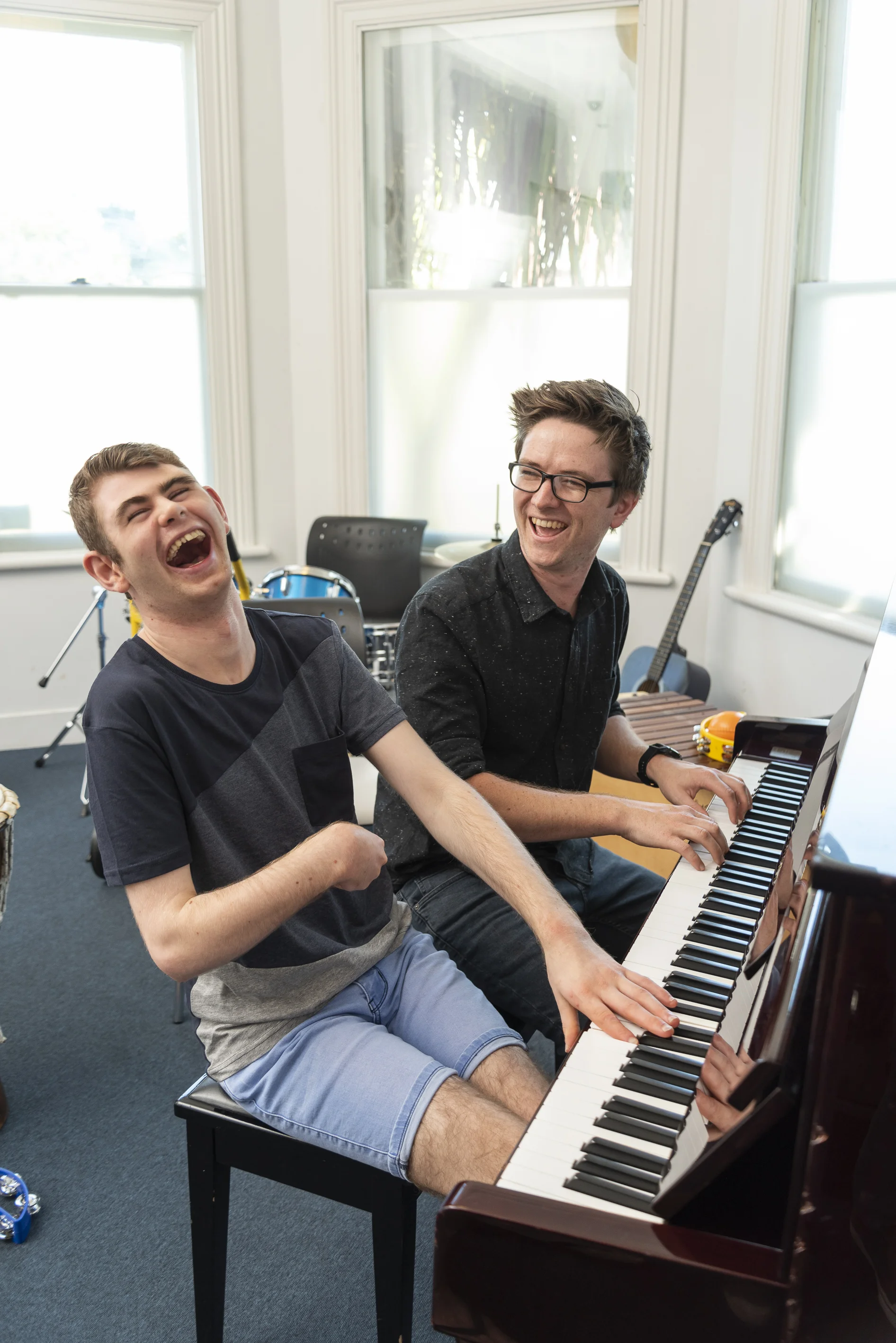 Daniel Olly piano laugh.jpg