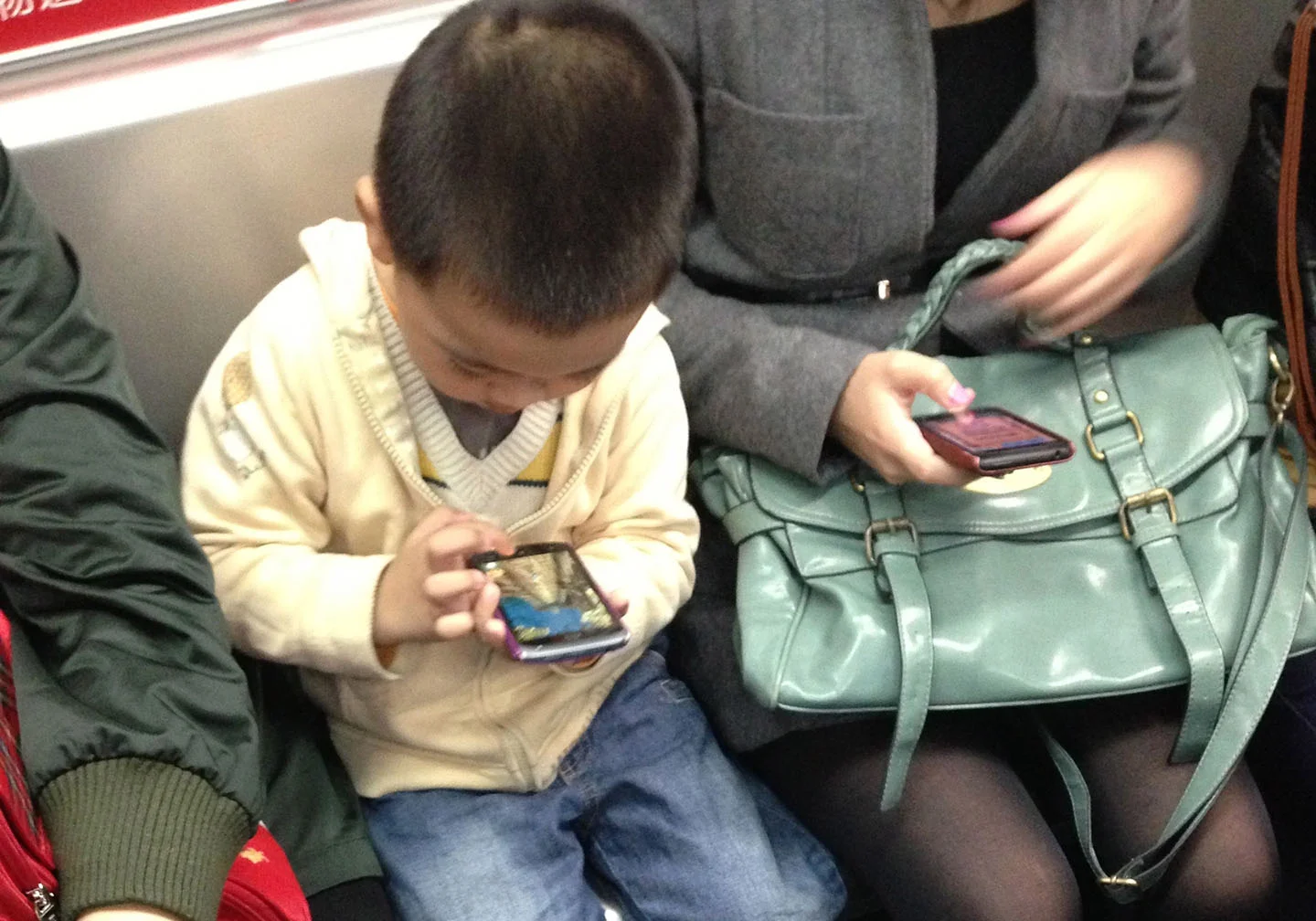 boy with phone cropped originalphotos.jpg