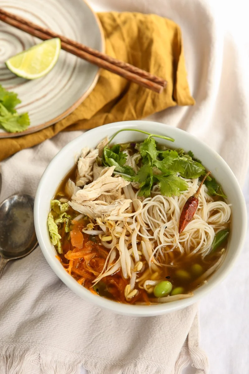 Asian Noodle Soup Vertical Chopsticks in Background.jpg
