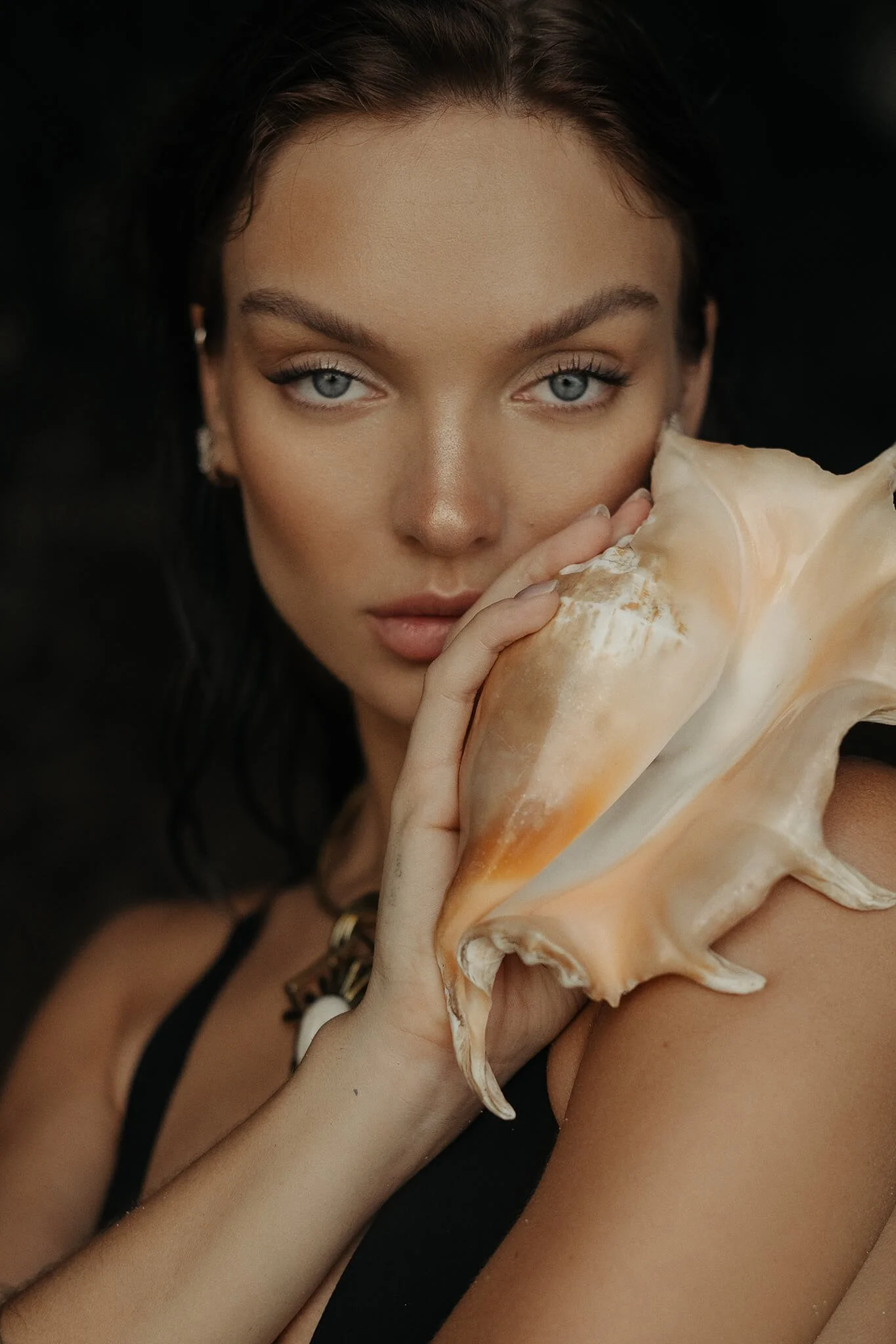 Outdoor portrait emphasizing expressive eyes and soft focus background
