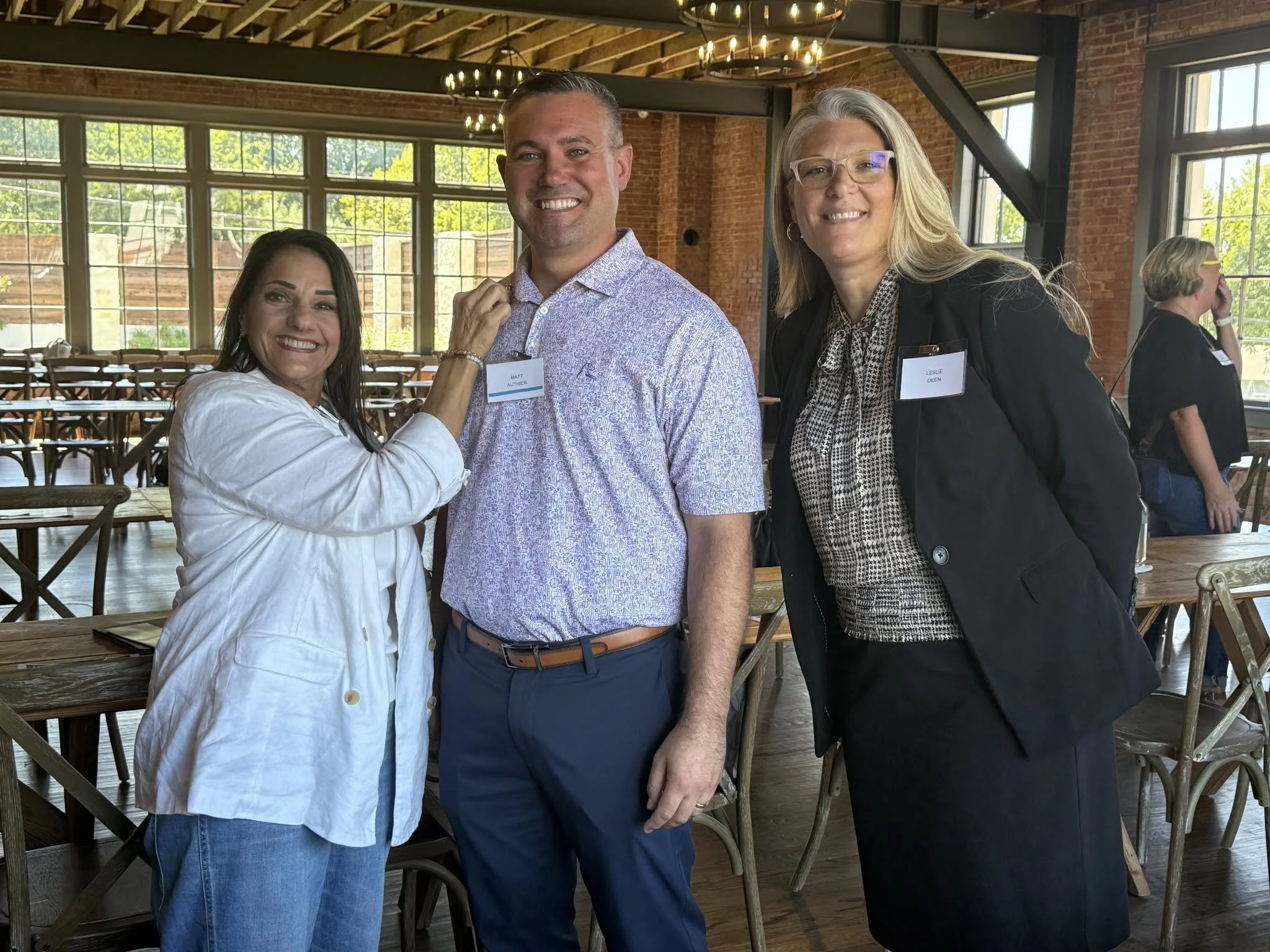 Matt Authier receiving his Pinwheel Award with Cammy Jackson, Board President and Leslie Deen, Executive Director