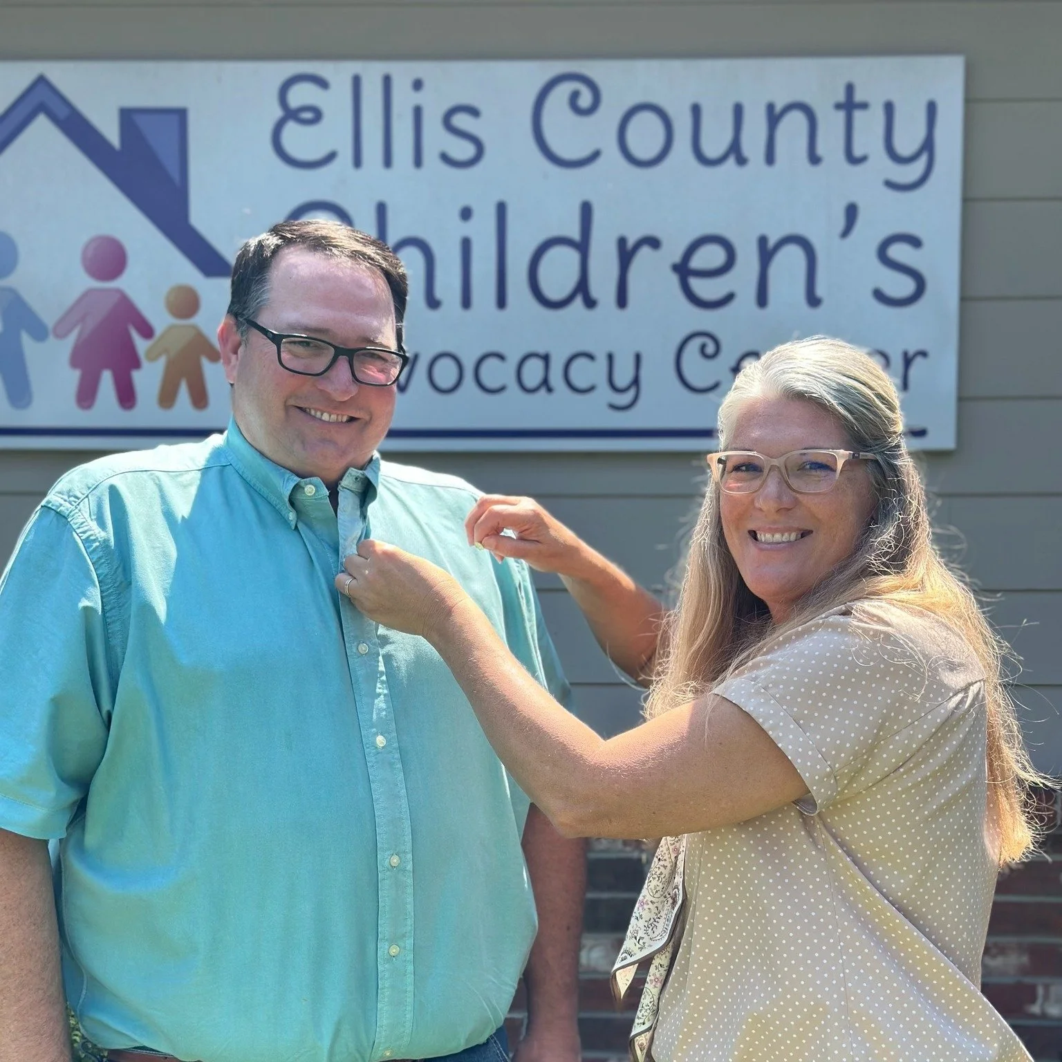John Reagan receiving his Pinwheel Award with Leslie Deen, Executive Director