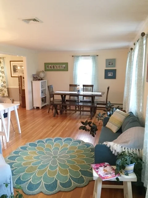 The addition of a sofa and window treatments makes the room even more inviting.