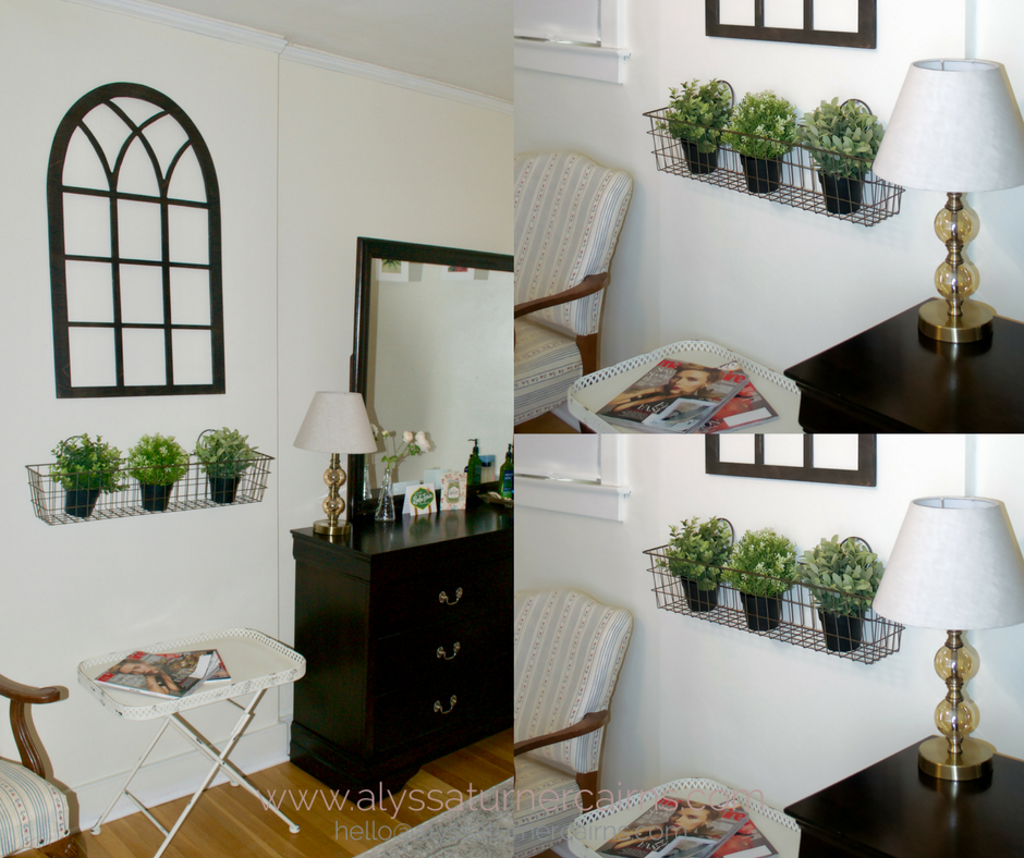 The existing espresso stained furniture blends seamlessly with the new black metal bed frame. The cathedral window in a dark finish ties it together, and the mix of family heirlooms (the upholstered chair) and new pieces (the window and greenery) make the room feel purposefully designed.