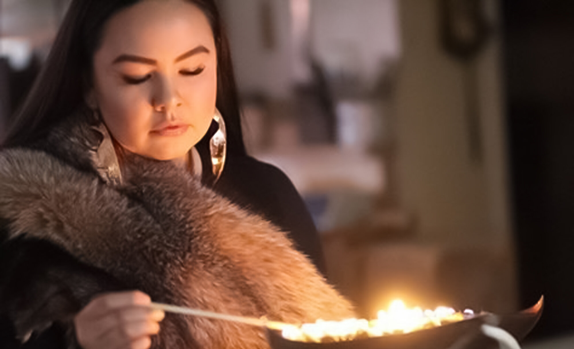   Mathew Nuqingaq  , Maatalii Okalik Wearing Copper Foxy Lady Earrings , 2019. Copper and silver, 10 x 3 cm. COURTESY OF THE ARTIST 