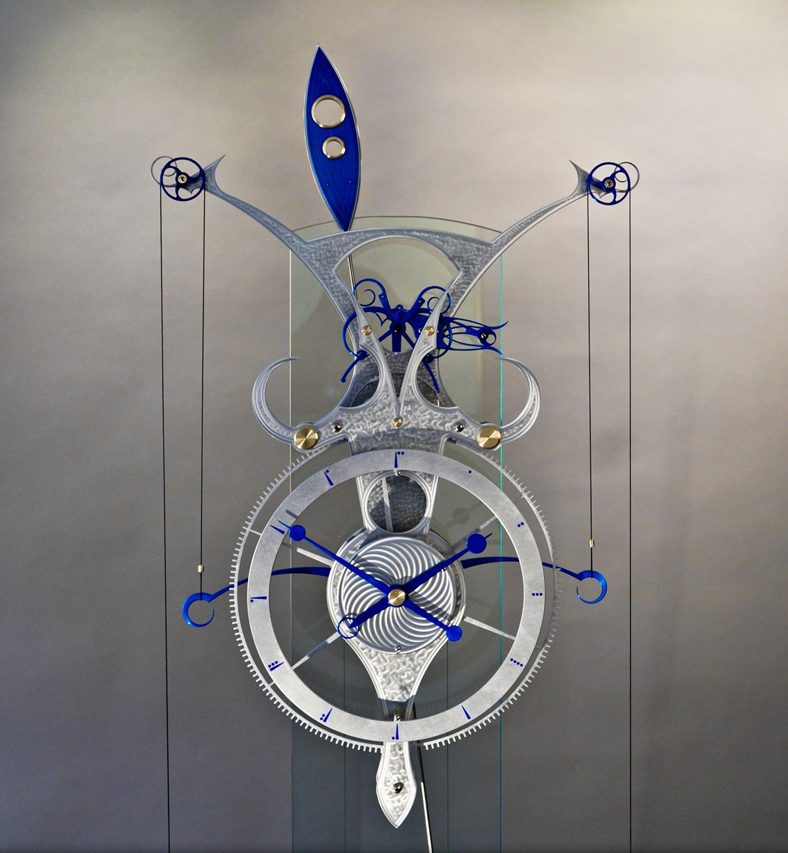   Isochronal Blue , 2016. Grasshopper escapement, automatic winding, brass, aluminum and quartz mechanism, 175 x 55 x 28 cm. Photo: Mark Hopper Photography. 