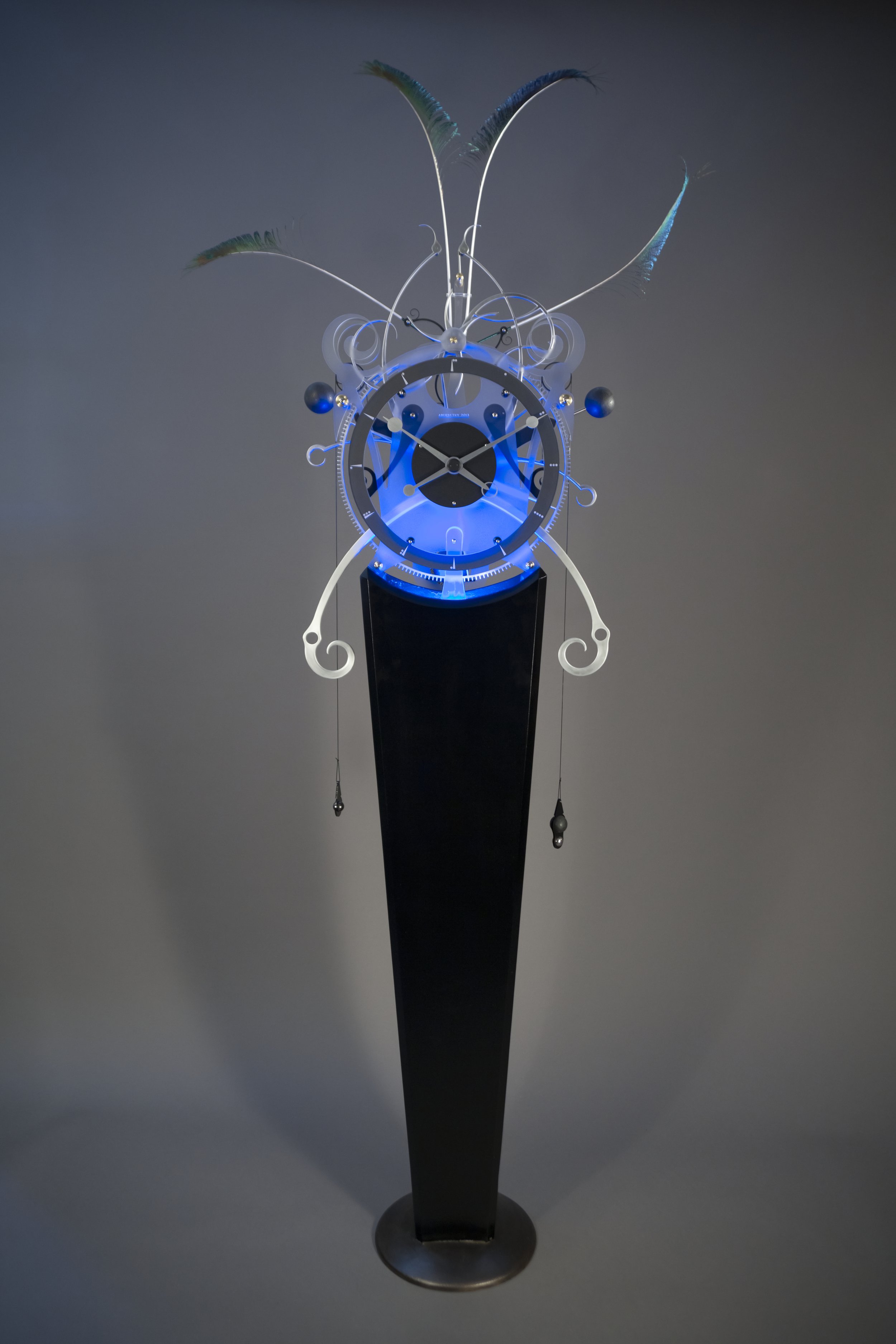   Insionn , 2020. Copper, brass, aluminum, acrylic, peacock feathers, gravity escapement and LED lighting, 200 x 84 x 28 cm. Photo: Mark Hopper Photography. 