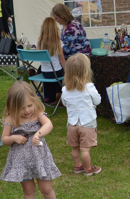 Girl looking at bug on her arm.jpeg