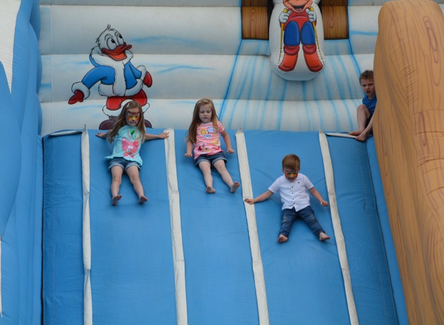 Three kids going down slide.jpeg