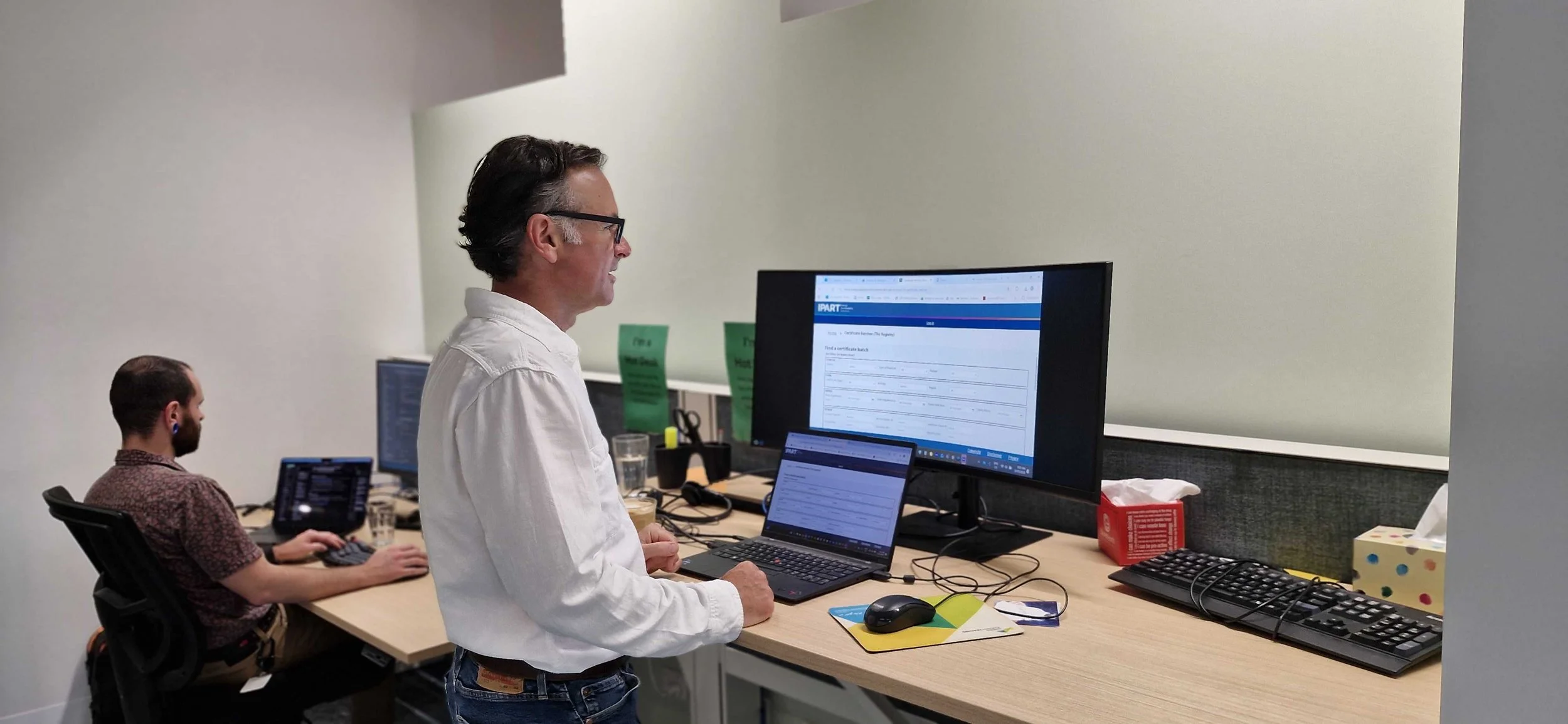Computer screen displaying financial graphs and charts with lines indicating data trends in a monochrome color scheme.