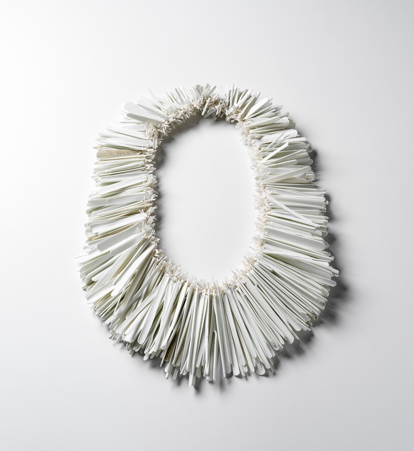 Down the Rabbit Hole, 2021, necklace, weathered plastic cubby house wall, waxed cord, Photo Grant Hancock, 45 x 27 x 4cm.jpg