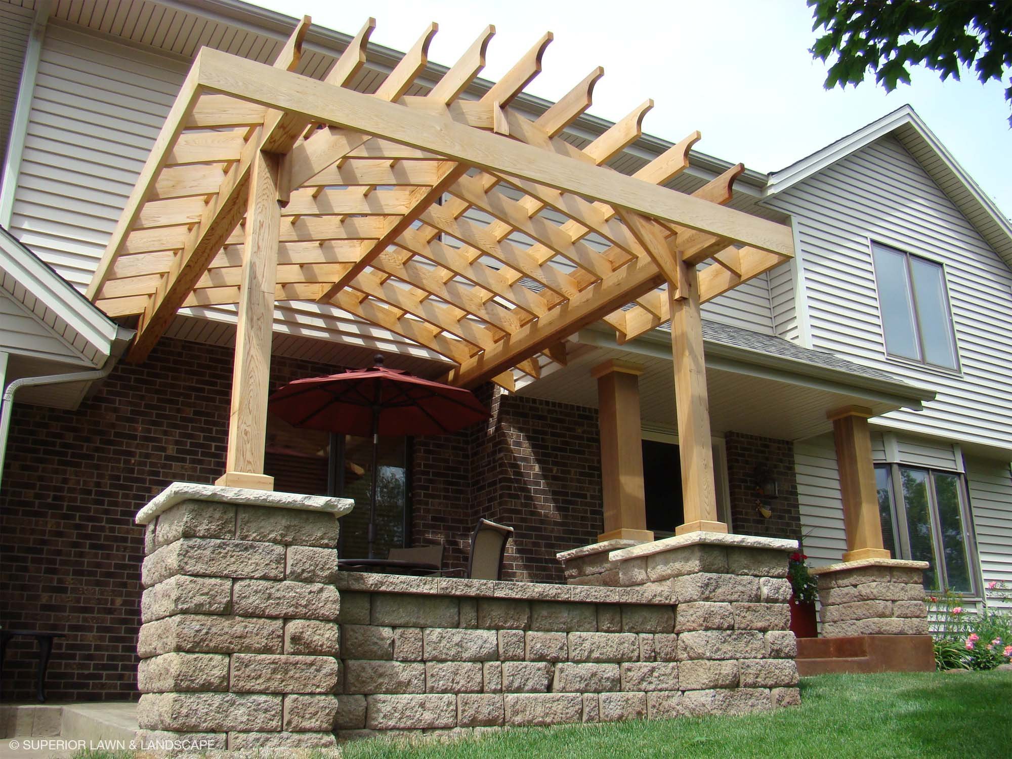 superior-lawn-landscape-front-entryways-027-pergola-with-stone-wall.jpg