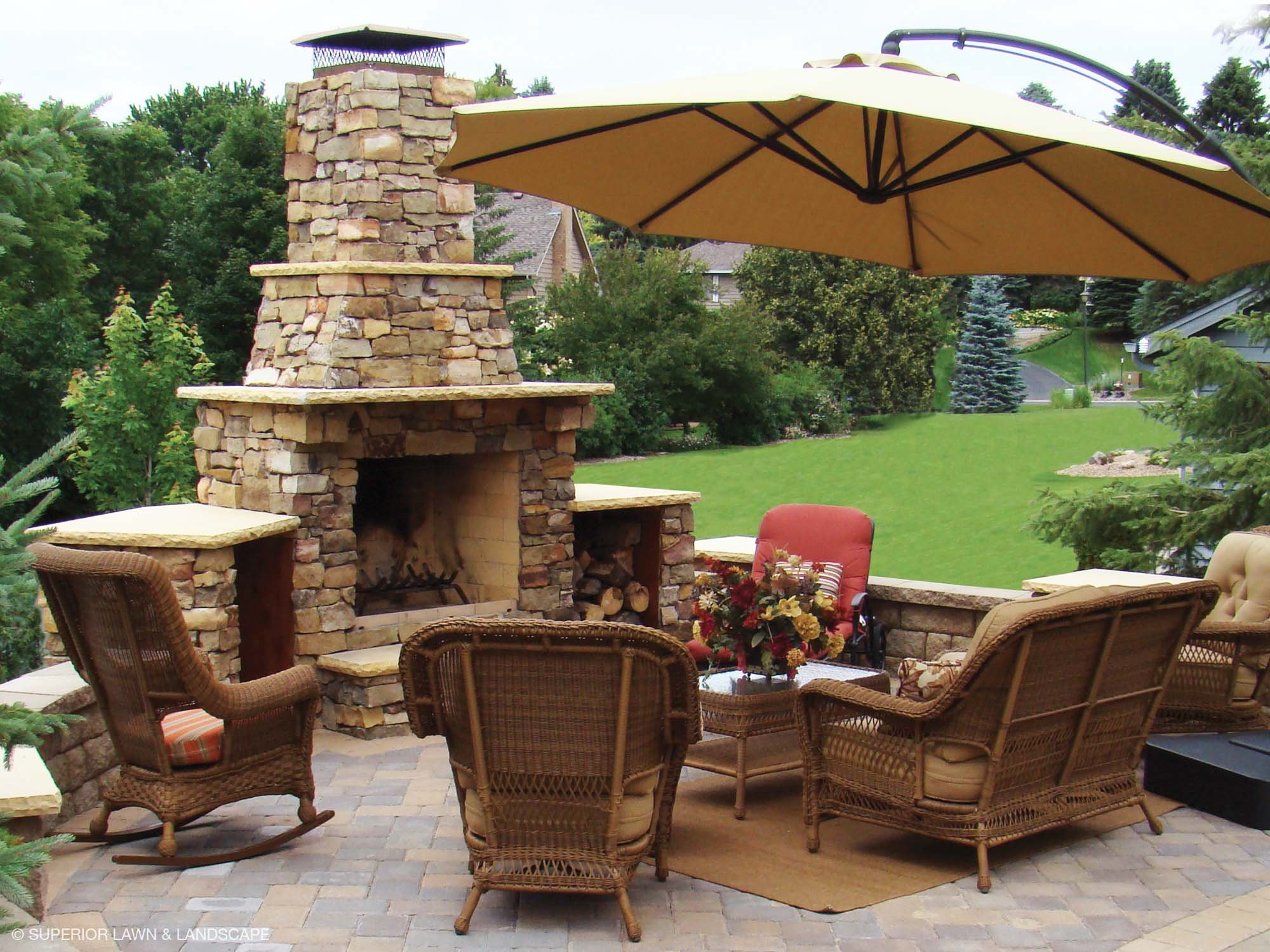 superior-lawn-landscape-outdoor-living-032-back-yard-fireplace-patio.jpg